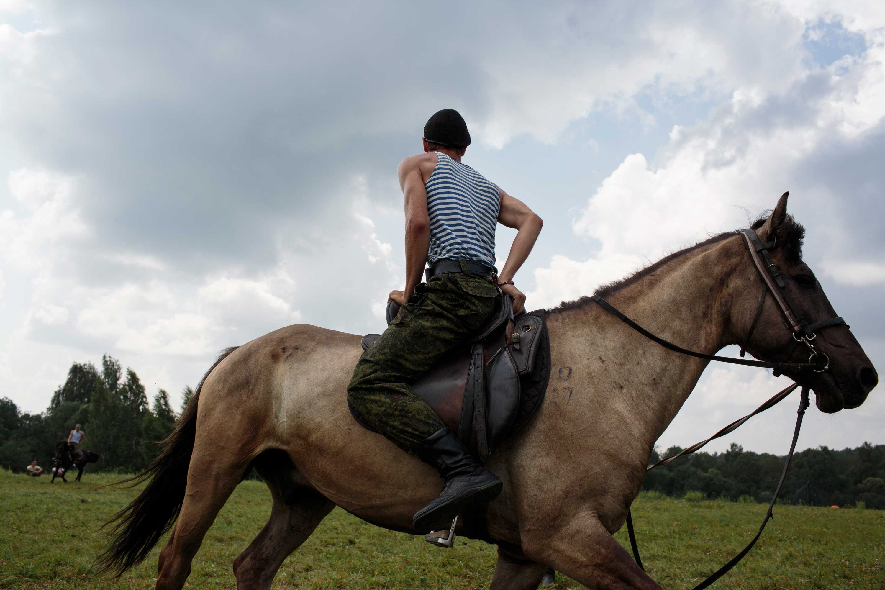 Students train horse-back riding at the Historical War Camp, in Borodino, Russia. July 28, 2016. The project statement of the camp says:  To awaken in the younger generation a keen interest in the history of the Fatherland, the glorious deeds of our ancestors, to facilitate the expansion of military-historical knowledge.