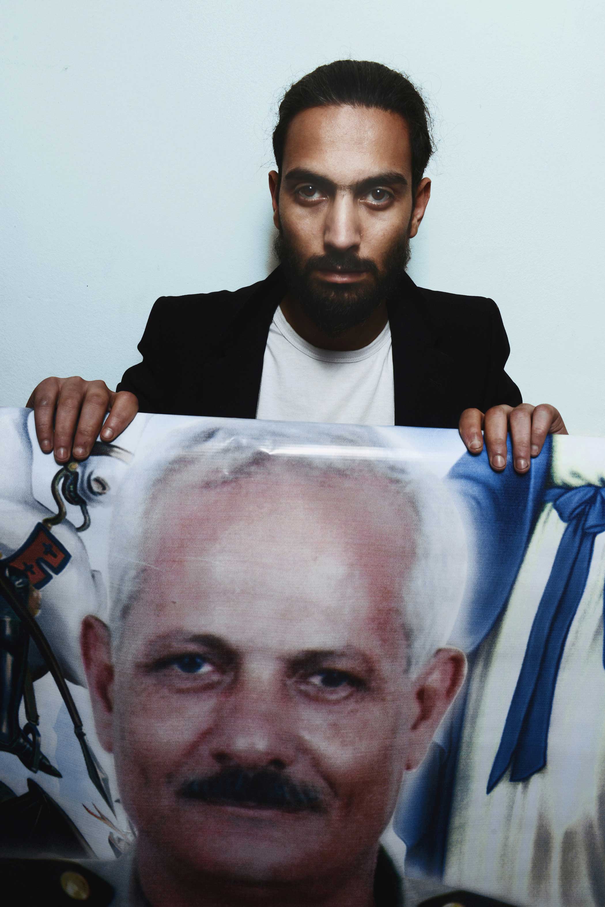 Emad Tadros, 27, holds a photo of his slain father, Medhat Tadros, 63. "My rather was a military officer and a man of God. He was known for being the man of duty," Emad said. "I was so sad when I first head the news, then I was relieved knowing he died in the church. He is a martyr," he added. "He always sat on the front bench in all services at the church. Next year on Palm Sunday, I will sit on the same bench hoping I would die like him."