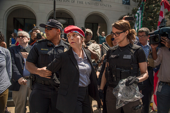 Rachel Ramone Donlan is arrested after handing out joints during 1st Annual Congressional #JointSession pot giveaway to credentialed Hill staff and the media at Constitution Ave. and First St. NE on April 20, 2017. (Tom Williams—CQ-Roll Call, Inc./Getty Images)