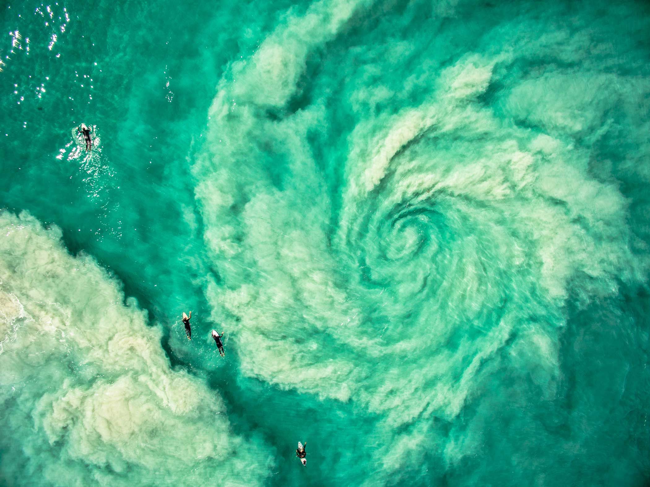 Surfers avoiding the hurricane rip in Western Australia.