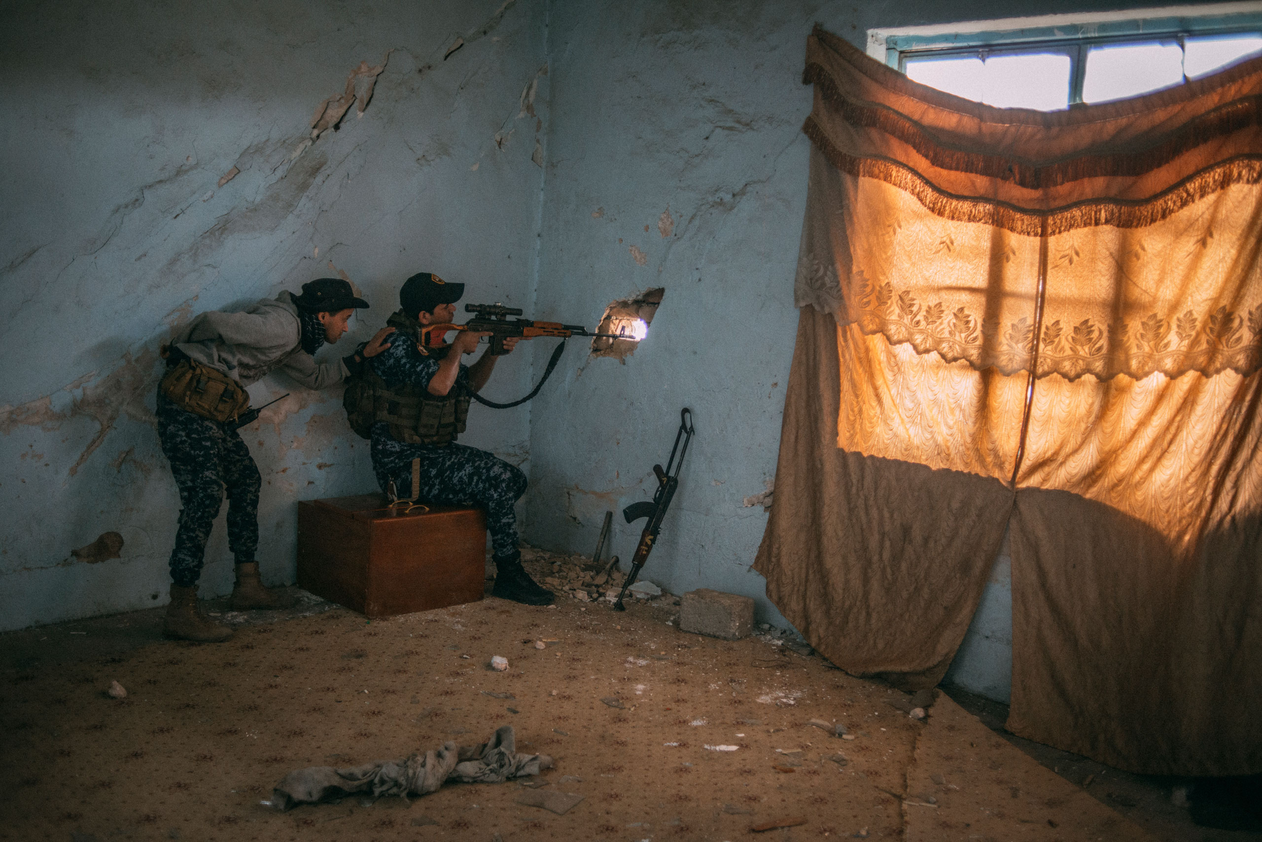 A sniper from the Iraqi Federal Police in the Dawasa neighborhood of Mosul on March 30. (Emanuele Satolli for TIME)