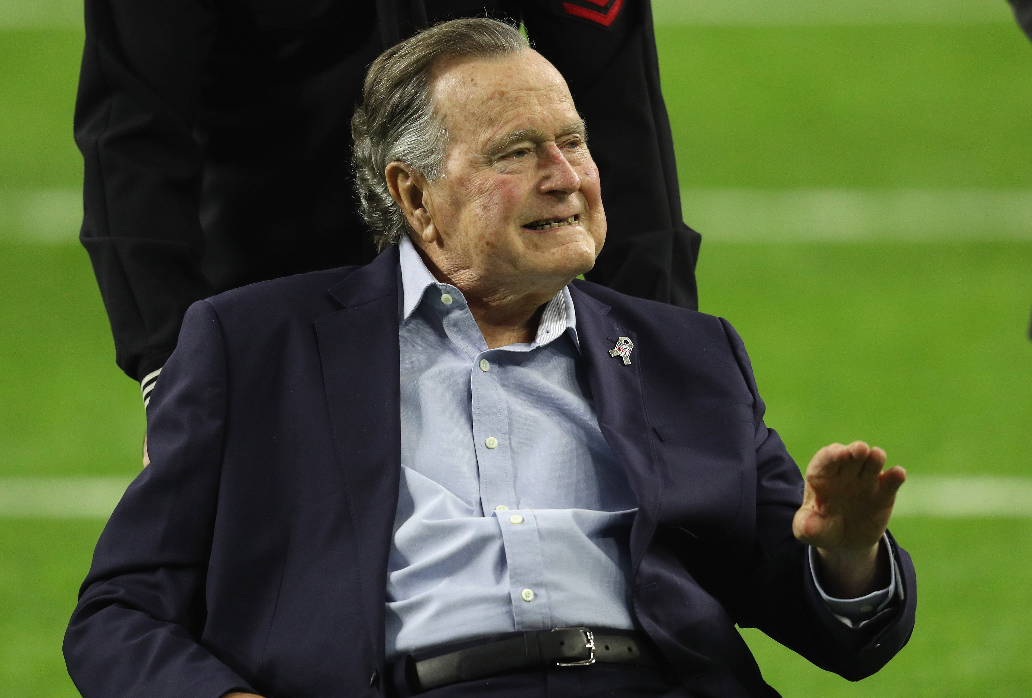 President George H.W. Bush arrives for the coin toss prior to Super Bowl 51 between the Atlanta Falcons and the New England Patriots at NRG Stadium on February 5, 2017 in Houston. (Patrick Smith—Getty Images)