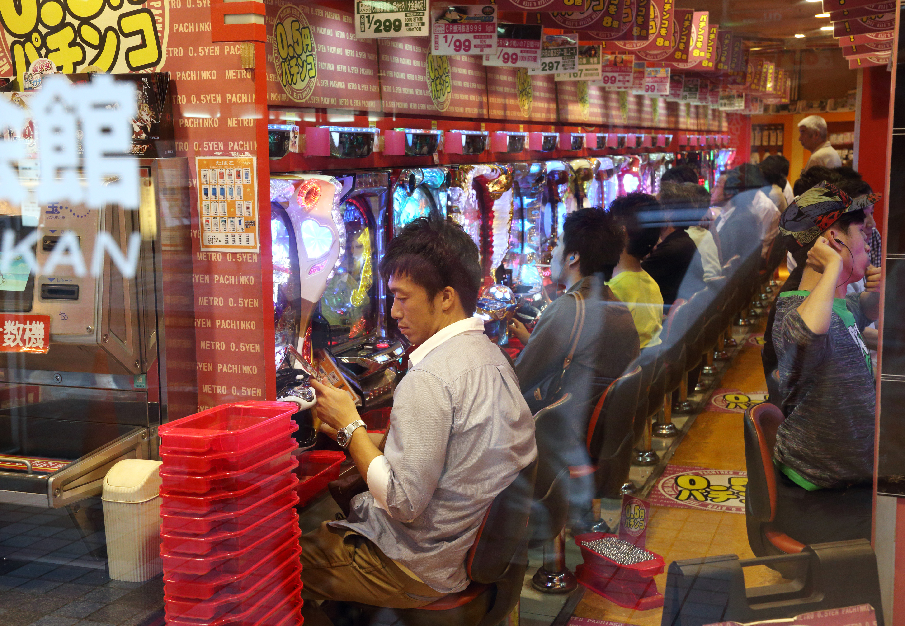 Customers in a pachinko parlor in Tokyo in June 2014. (Bloomberg/Getty Images)