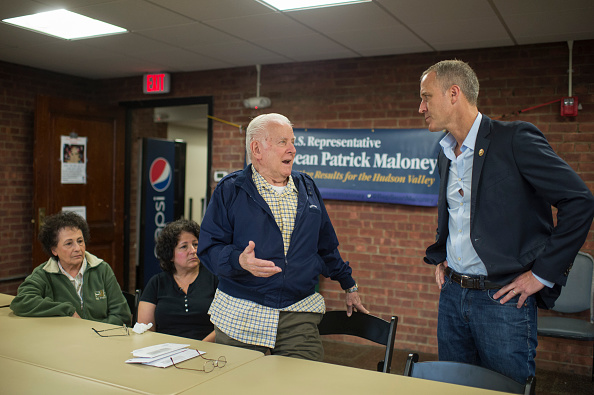 Rep. Sean Patrick Maloney, D-N.Y., talks with constituents Theresa Yantz, 79, left, her husband Larry, 81, standing, and their daughter Patricia Wenzel, 55, during a town hall in Newburgh, N.Y., June 11, 2016.