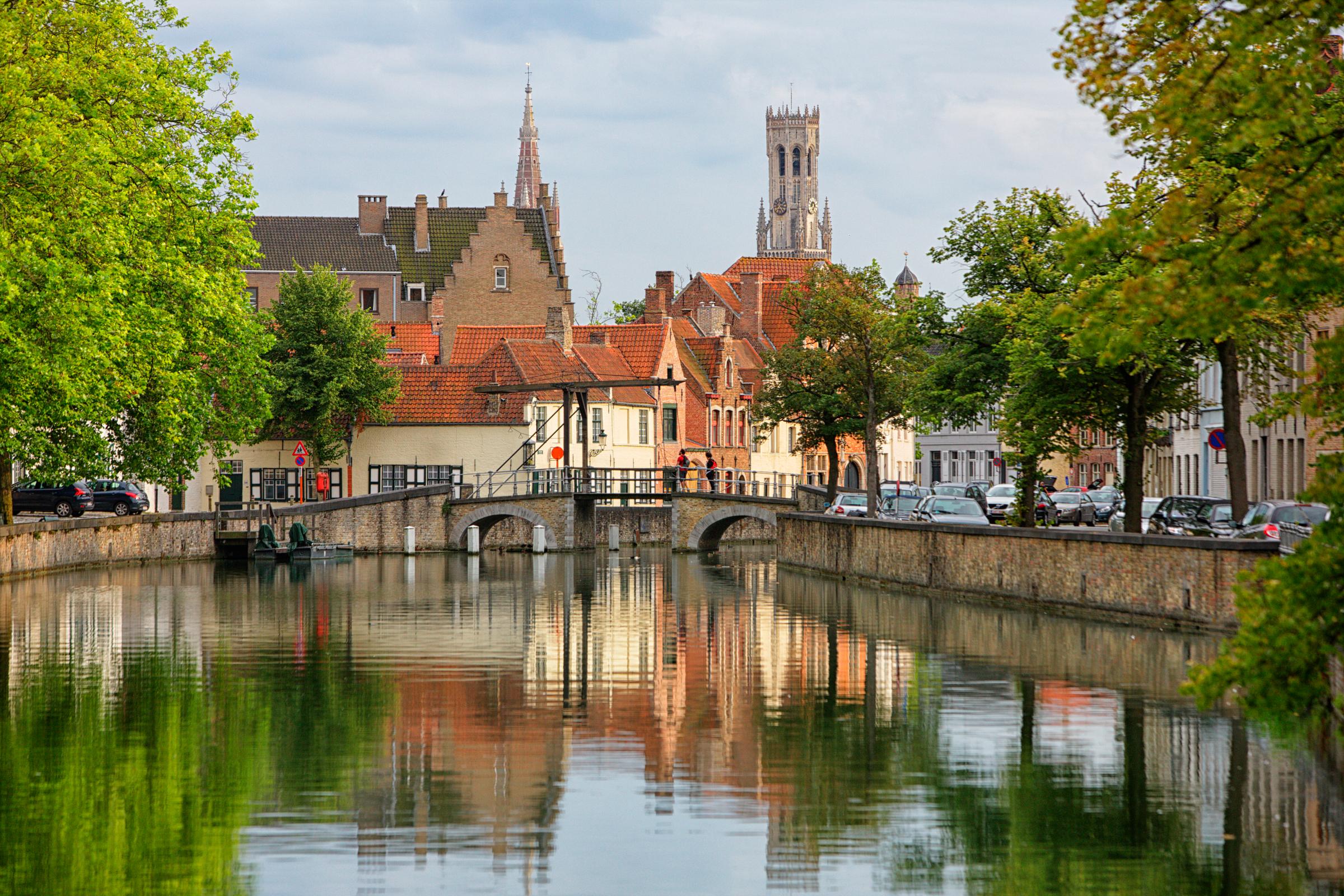 Belgium, Bruges, Churches reflecting in canals