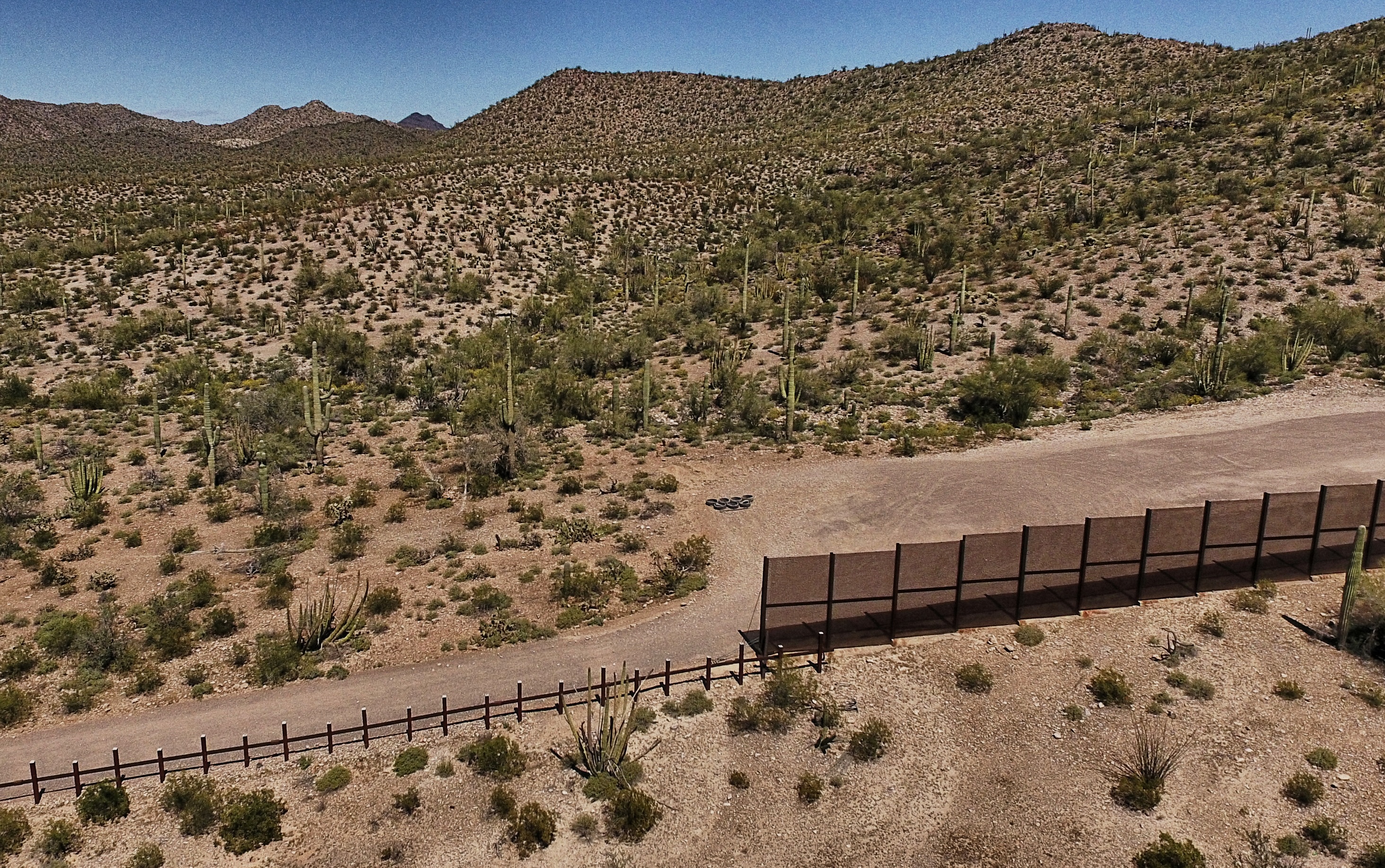 View of the metal fence along the border in Sonoyta, Sonora state, northern Mexico, between the Altar desert in Mexico and the Arizona desert in the United States, on March 27, 2017. PEDRO PARDO—AFP/Getty Images (PEDRO PARDO—AFP/Getty Images)