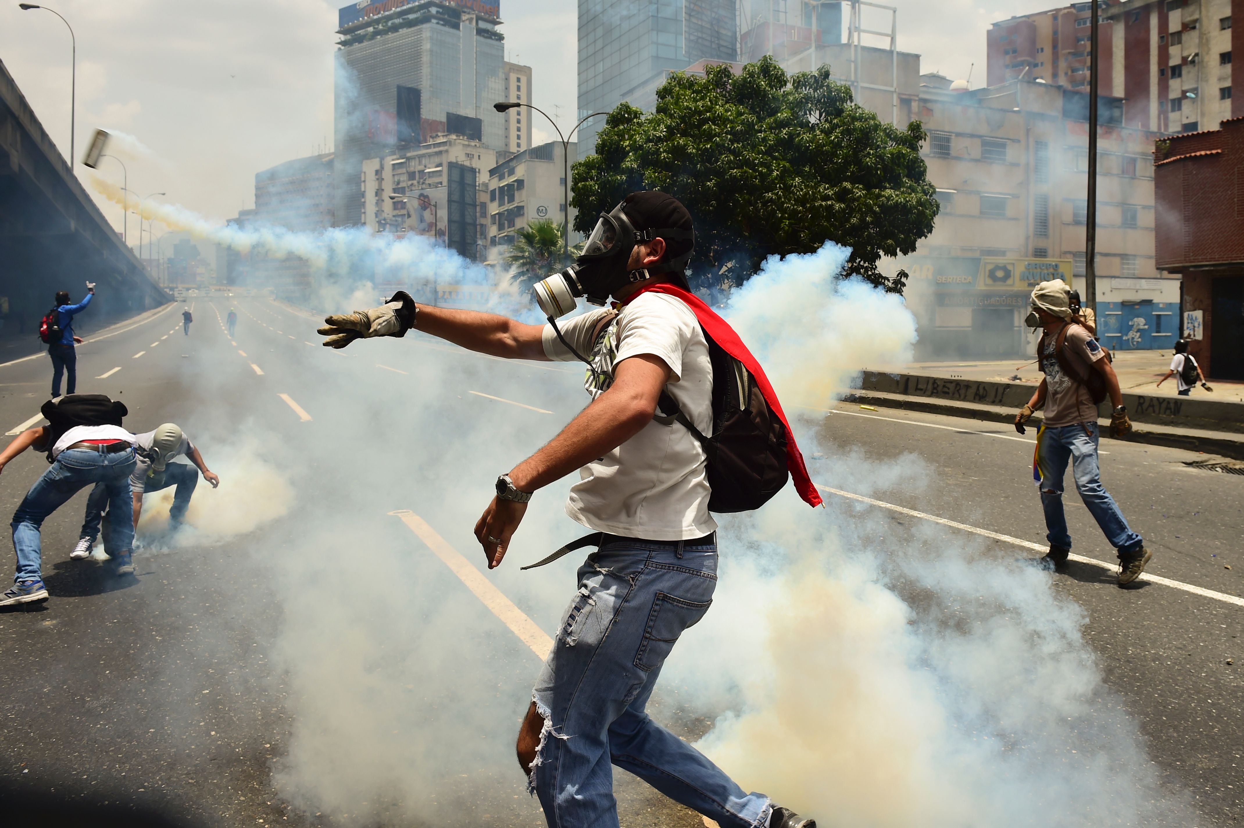 Demonstrators clash with the police during a rally against Venezuelan President Nicolas Maduro, in Caracas on April 19, 2017. (Ronaldo Schemidt—AFP/Getty Images)