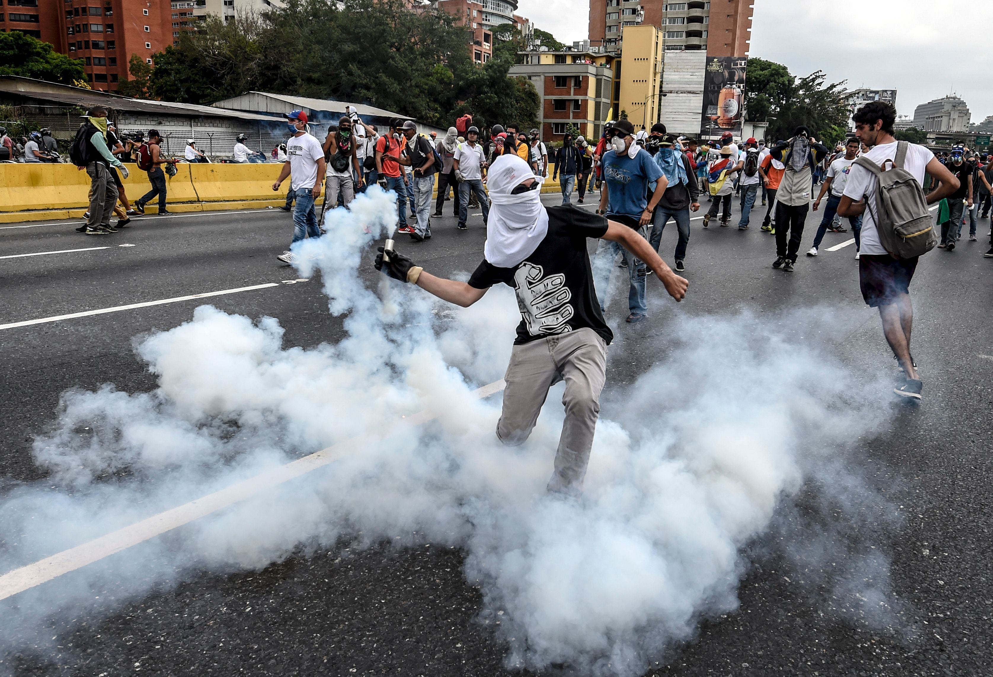 Demonstrators clash with the riot police during a protest against Venezuelan President Nicolas Maduro, in Caracas on April 20, 2017. (Juan Barreto—AFP/Getty Images)