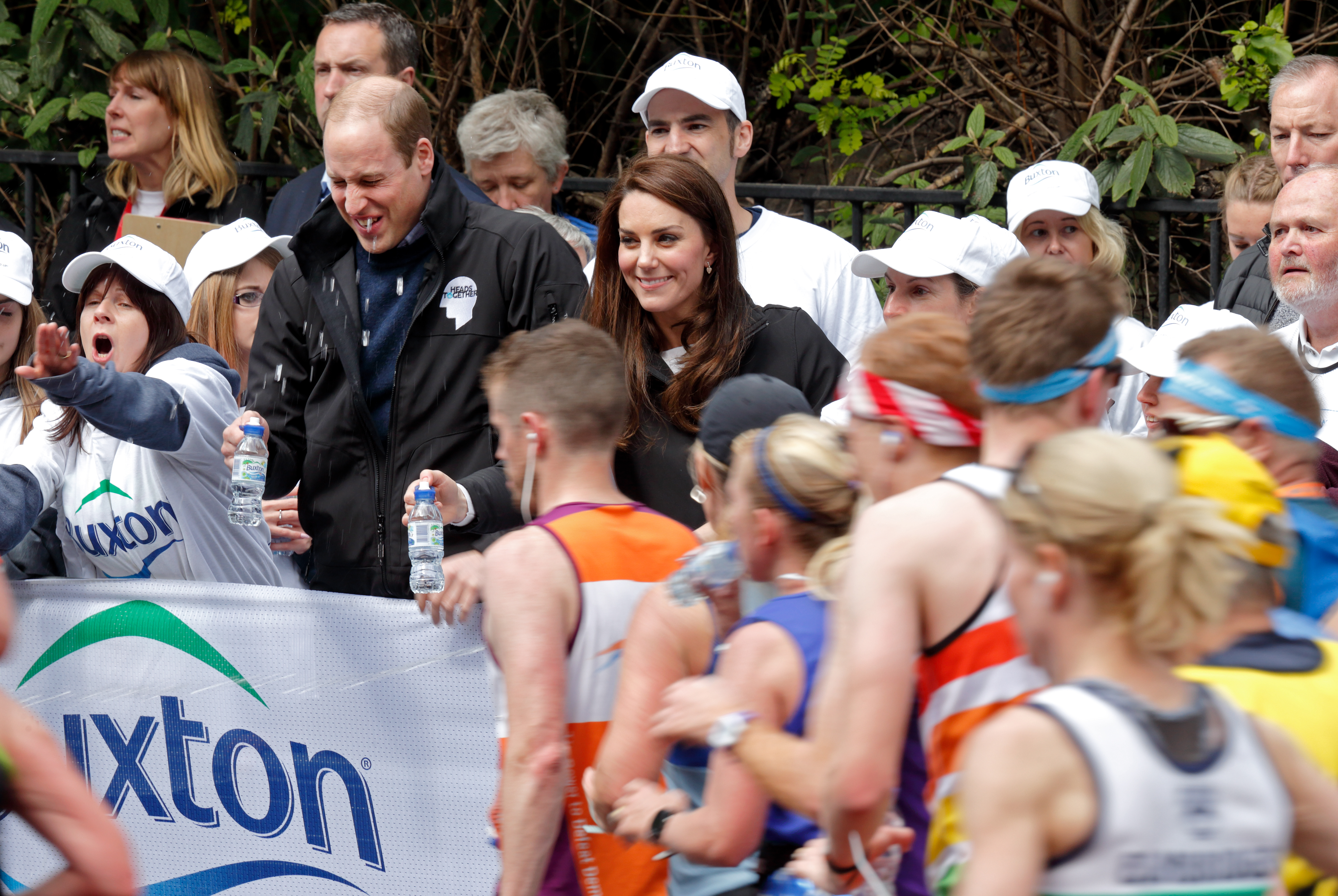 LONDON, UNITED KINGDOM - APRIL 23: (EMBARGOED FOR PUBLICATION IN UK NEWSPAPERS UNTIL 48 HOURS AFTER CREATE DATE AND TIME) Prince William, Duke of Cambridge is squirted with water as he &amp; Catherine, Duchess of Cambridge hand out water to runners taking part in the 2017 Virgin Money London Marathon on April 23, 2017 in London, England. The Heads Together mental heath campaign, spearheaded by The Duke &amp; Duchess of Cambridge and Prince Harry, is the marathon's 2017 Charity of the Year. (Photo by Max Mumby/Indigo/Getty Images) (Max Mumby—Getty Images)