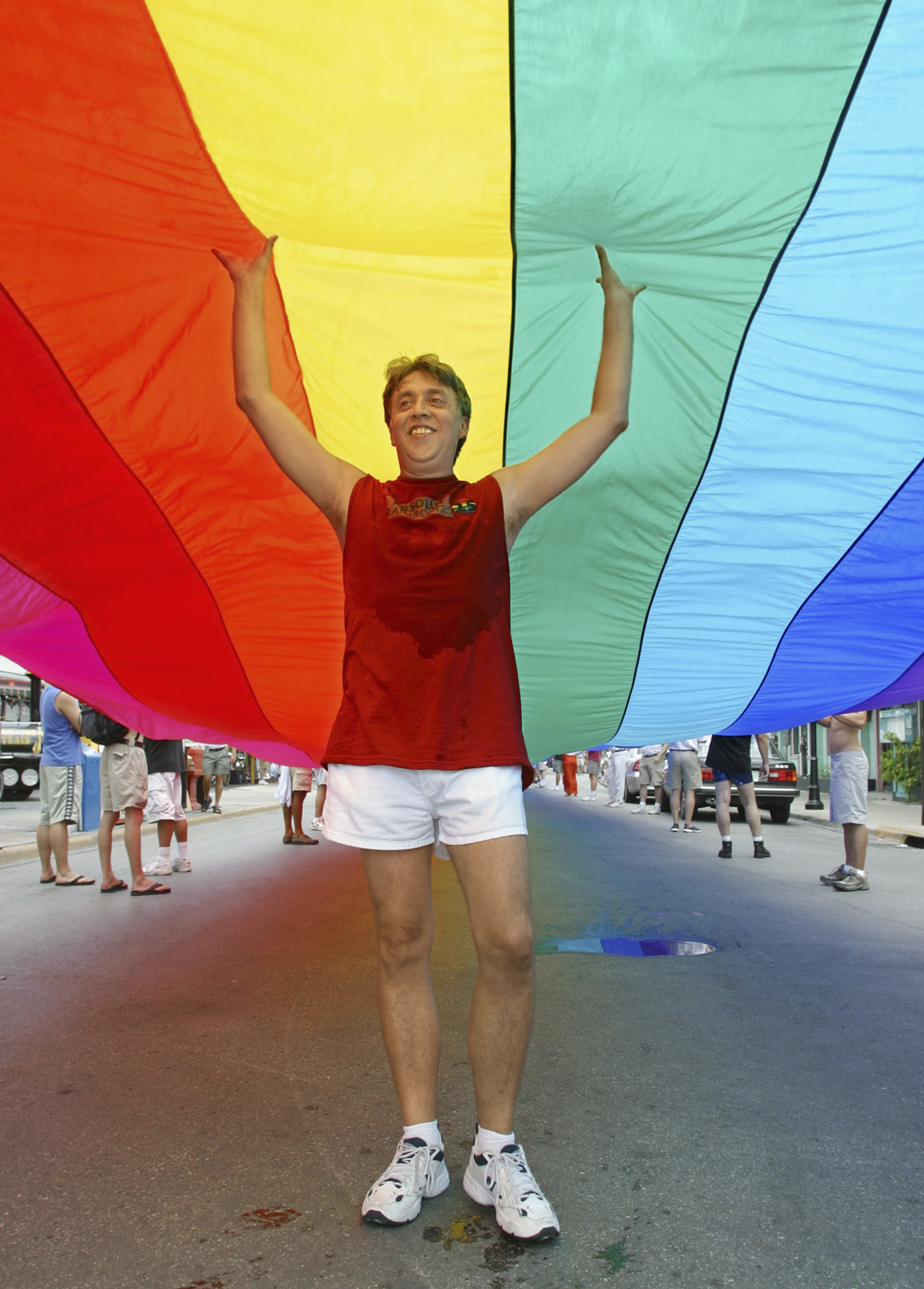 Baker helps stretch the world’s longest rainbow flag in 2003 (Mike Hollar—Florida Keys News Bureau/Getty Images)