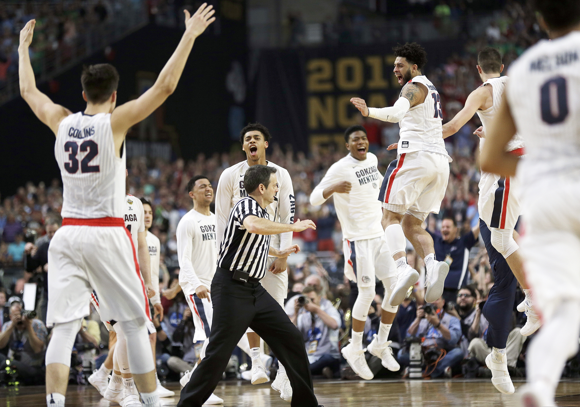 Gonzaga players celebrate after the semifinals of the Final Four NCAA college basketball tournament against South Carolina, on April 1, 2017, in Glendale, Ariz. Gonzaga won 77-73. (David J. Phillip—AP)