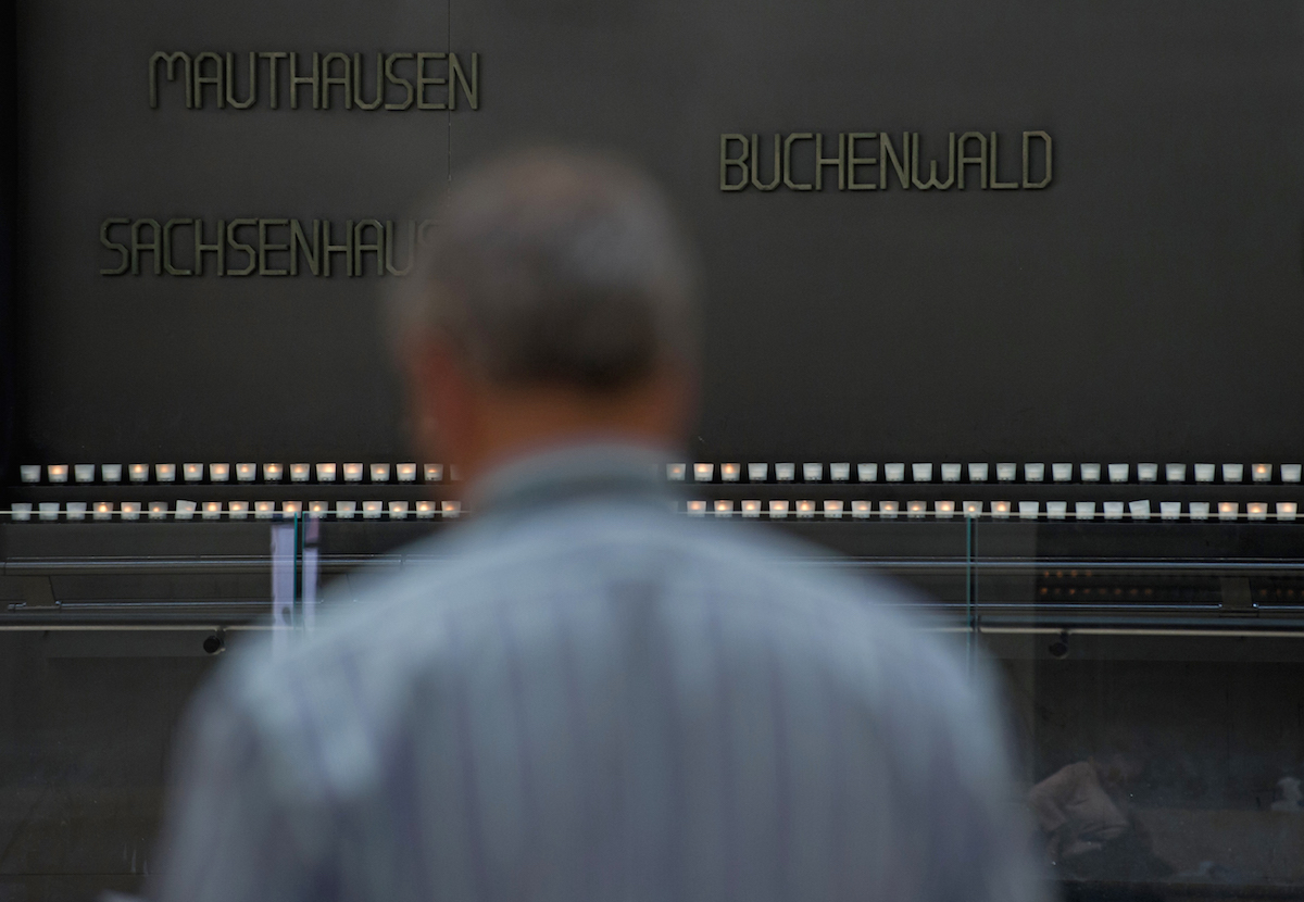 A man reads the names of vitims of the Holocaust in the Hall of Remebrance at the Holocaust Memorial Museum in Washington on Holocaust Remembrance Day in 2013. (Nicholas Kamm—AFP/Getty Images)