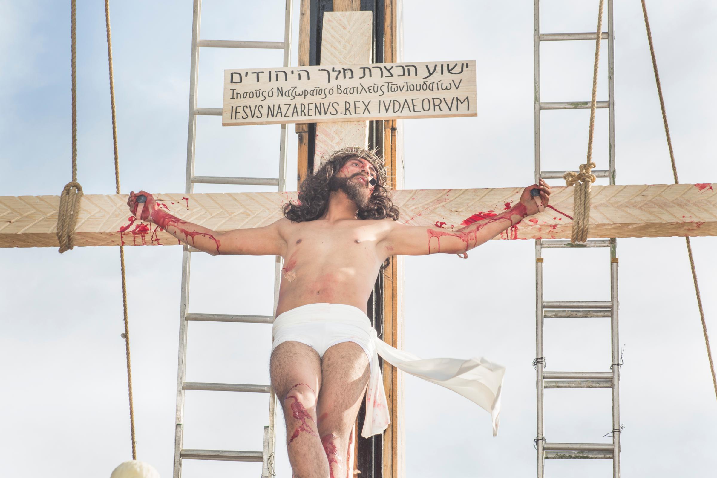 An actor playing the role of Jesus during Holy Week celebrations in Iztapalapa, Mexico. The actor chosen to play Christ goes through a year of spiritual and physical training before performing the role. In Mexico many communities stage processions for Good Friday.