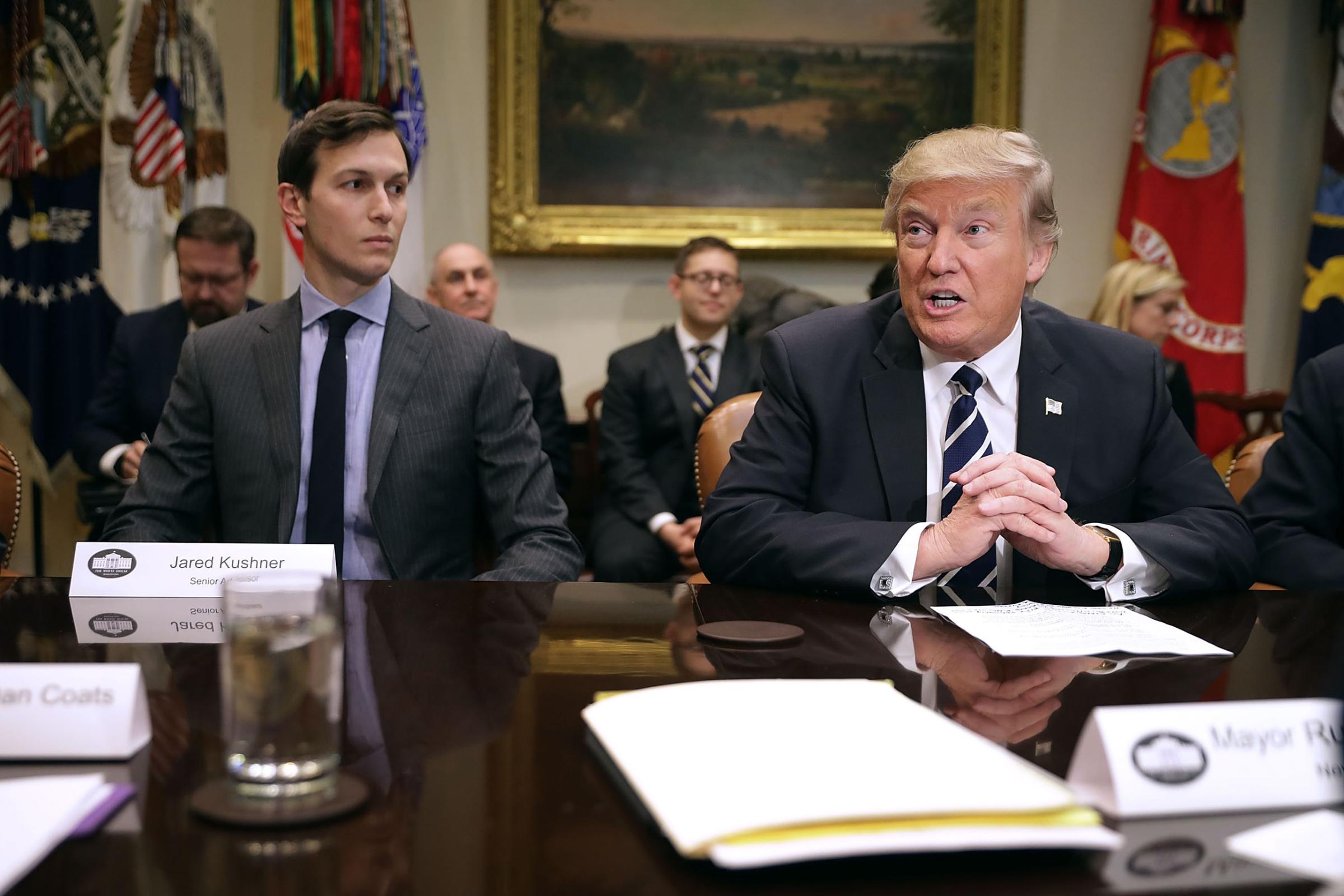 U.S. President Donald Trump (R) delivers remarks at the beginning of a meeting with his son-in-law and Senior Advisor Jared Kushner and government cyber security experts in the Roosevelt Room at the White House in Washington, D.C., Jan. 31, 2017.
