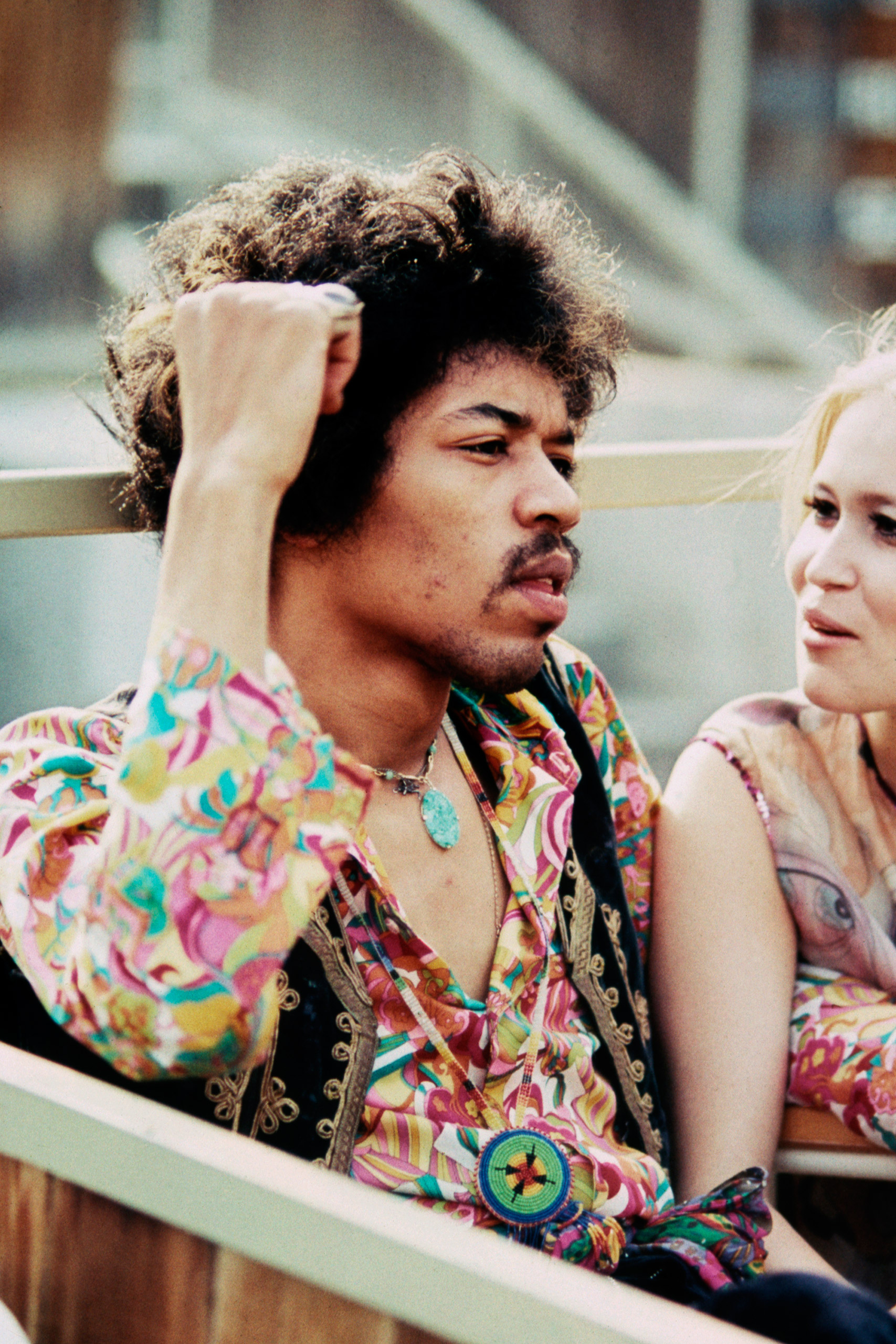 Jimi Hendrix sits next to Carmen Borrero in a Pool Box seat during afternoon sound check at the Hollywood Bowl, Sept. 14, 1968.