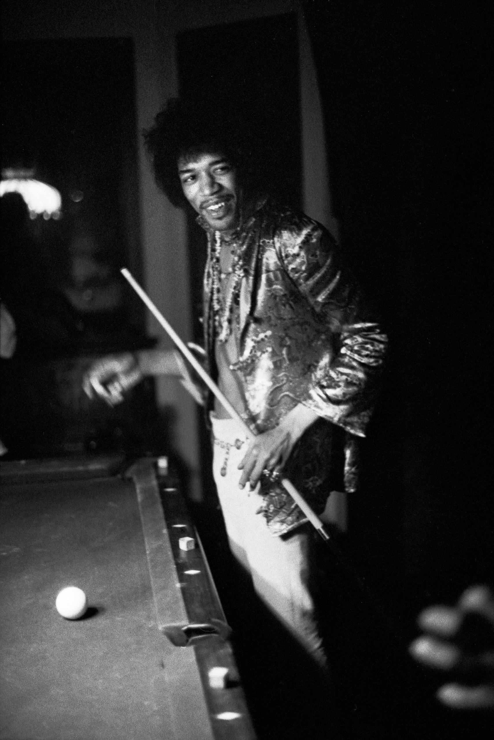 Jimi Hendrix shoots pool at the Bel Air home of John and Michelle Phillips in Los Angeles, California, July 1, 1967.