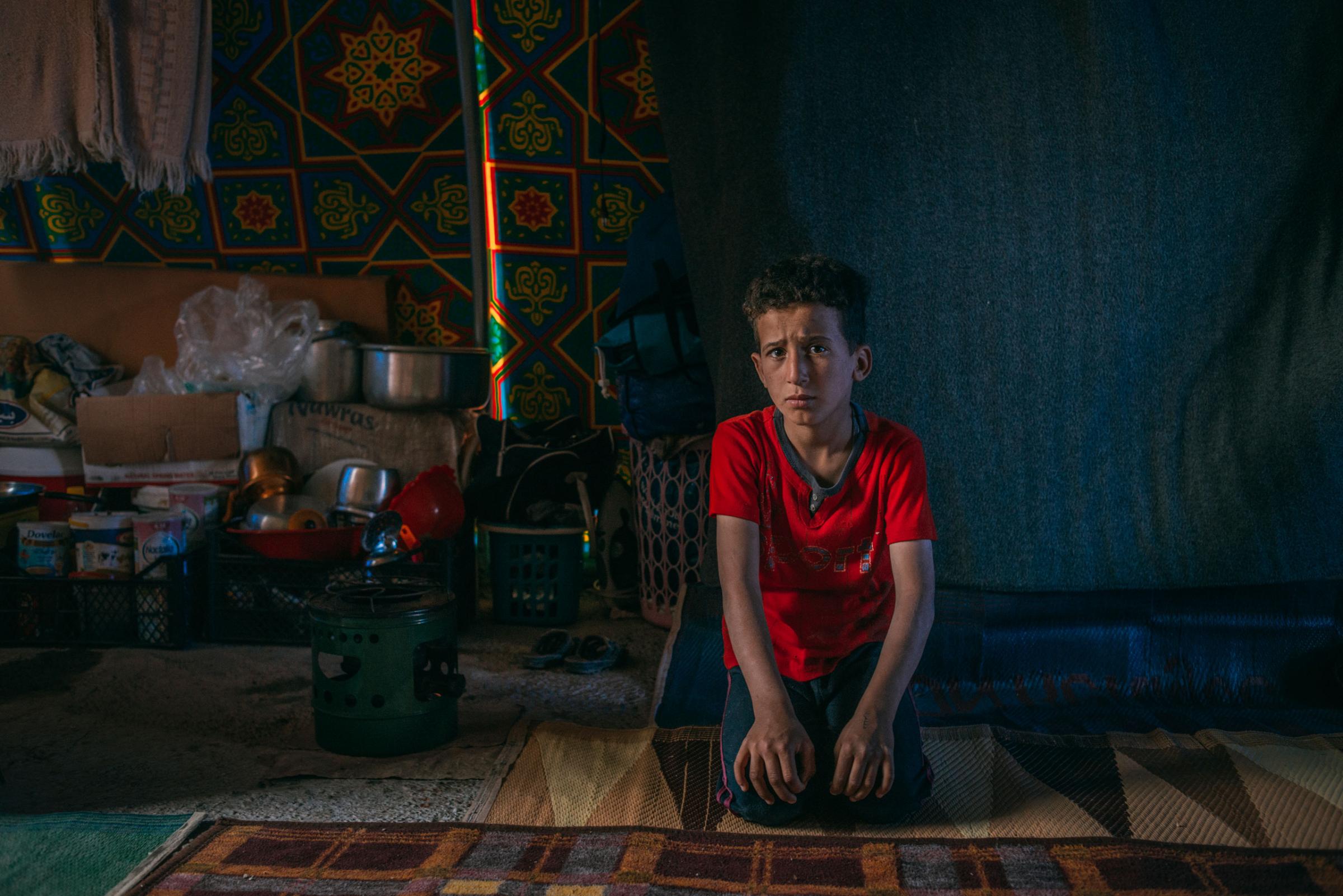 Hassan Falah Hamid, 10, lives in the Hamam al-Alil displacement camp south of Mosul. On April 6, 2017, he answered a few questions about his recent days in this war zone. His most recent meal? Fava beans. What does he think about at night? He was afraid of ISIS and the shelling. His favorite toy? He doesn't have toys in the camp, but back at home it was a bicycle. What does he want to be when he grows up? A teacher.