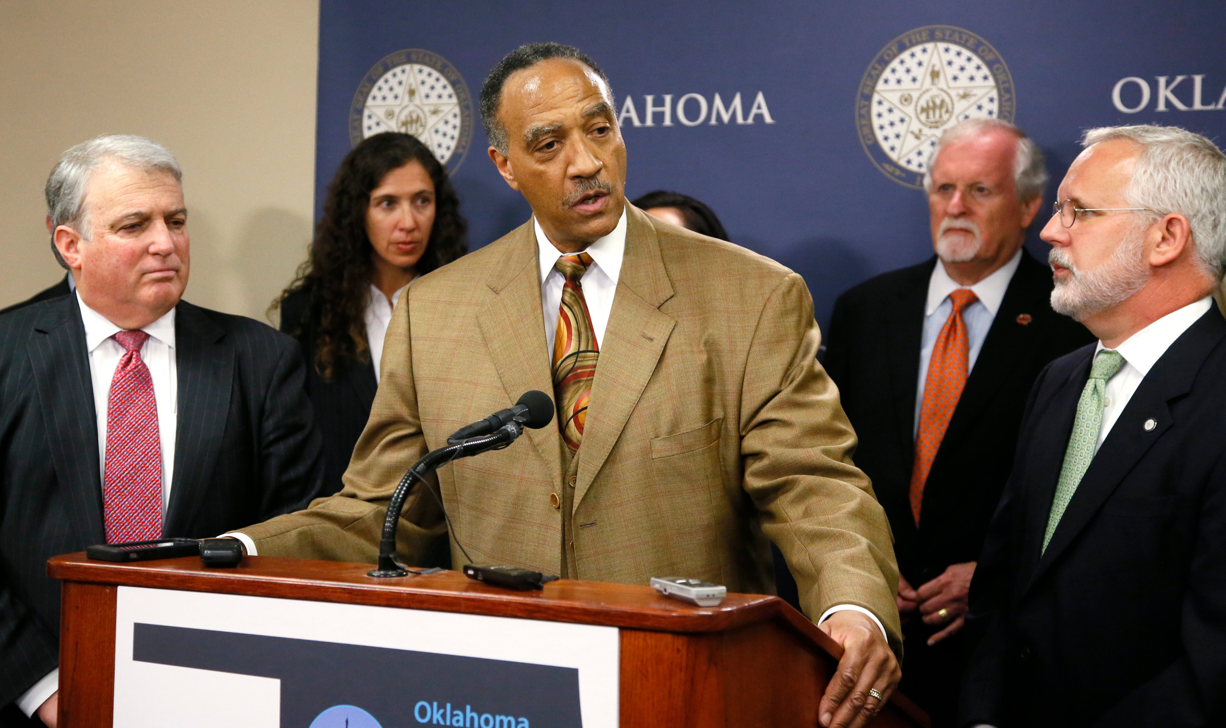 Robert H. Alexander, Jr., center, a member of the Oklahoma Death Penalty Review Commission, speaks during a news conference in Oklahoma City, Tuesday, April 25, 2017. The commission released a report that says the state should extend its moratorium on capital punishment. At left is Andy Lester and at right is former Oklahoma Gov. Brad Henry. (AP Photo/Sue Ogrocki) (Sue Ogrocki&mdash;AP)