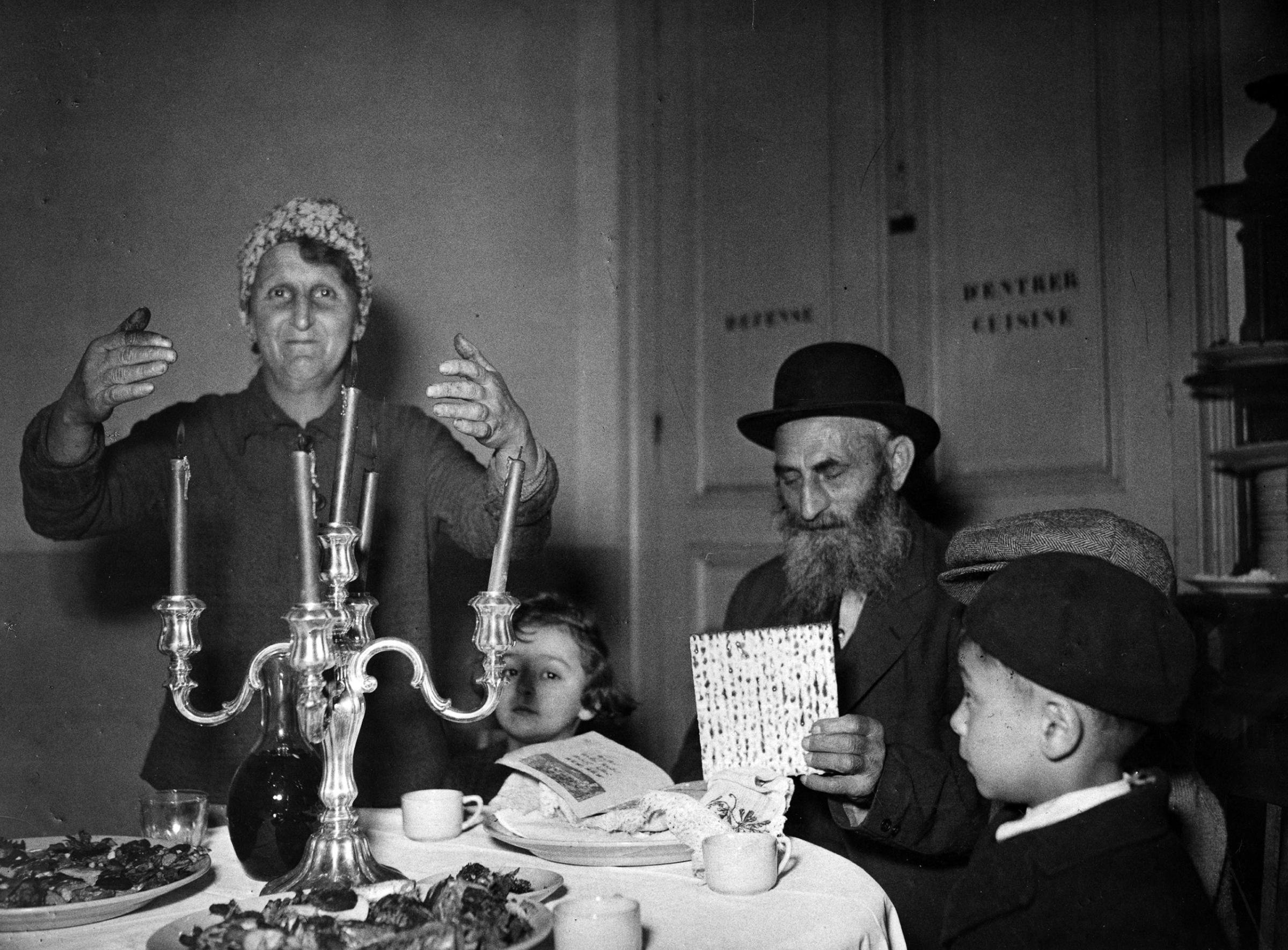 Two elderly occupants of a shelter for Jews transients in France at a seder. France, c.1947. Photographer unknown.