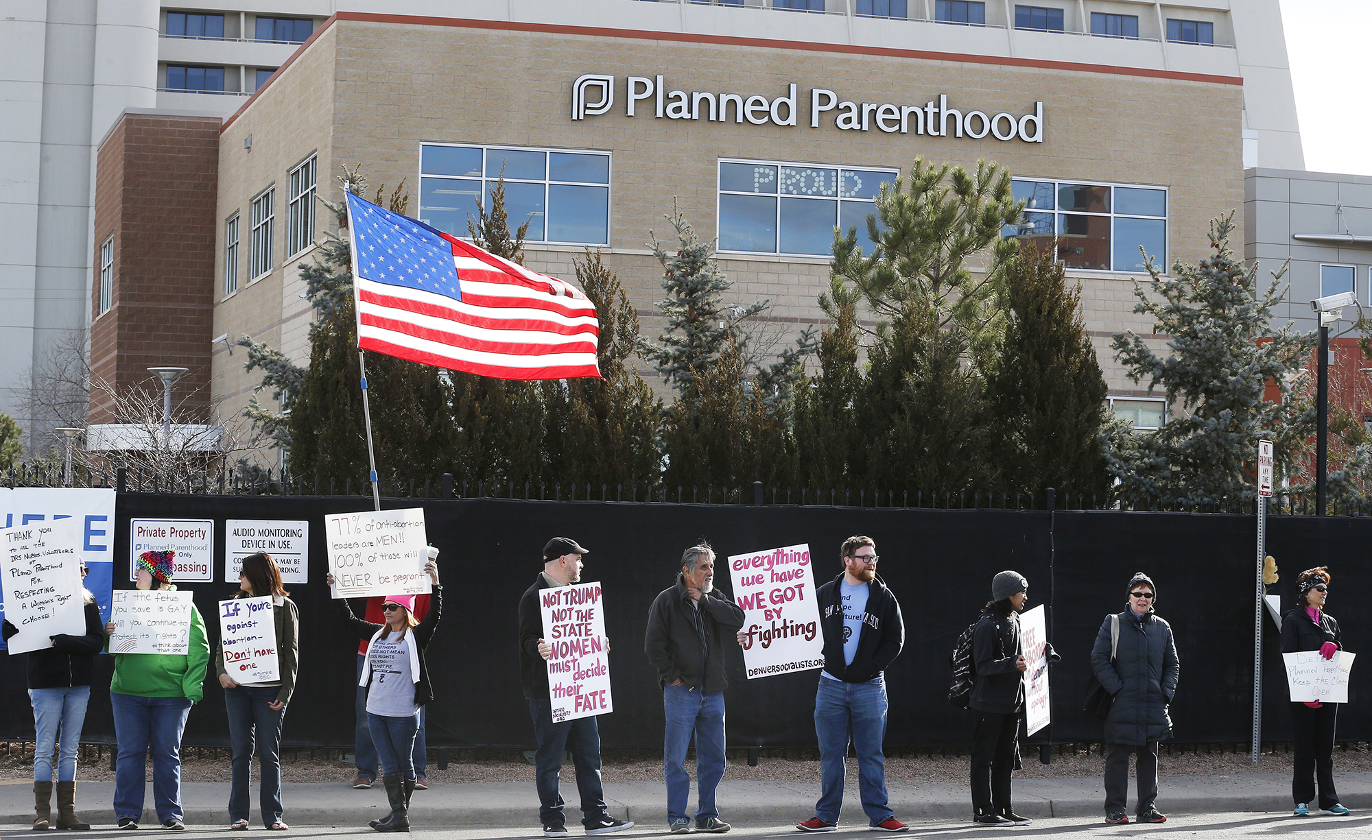 Pro-choice counter-protesters hold signs supporting a woman's right to choose abortion, as nearby anti-abortion activists held a rally in front of Planned Parenthood of the Rocky Mountains, in Denver, Colo., on Feb. 11, 2017. (Brennan Linsley—AP)