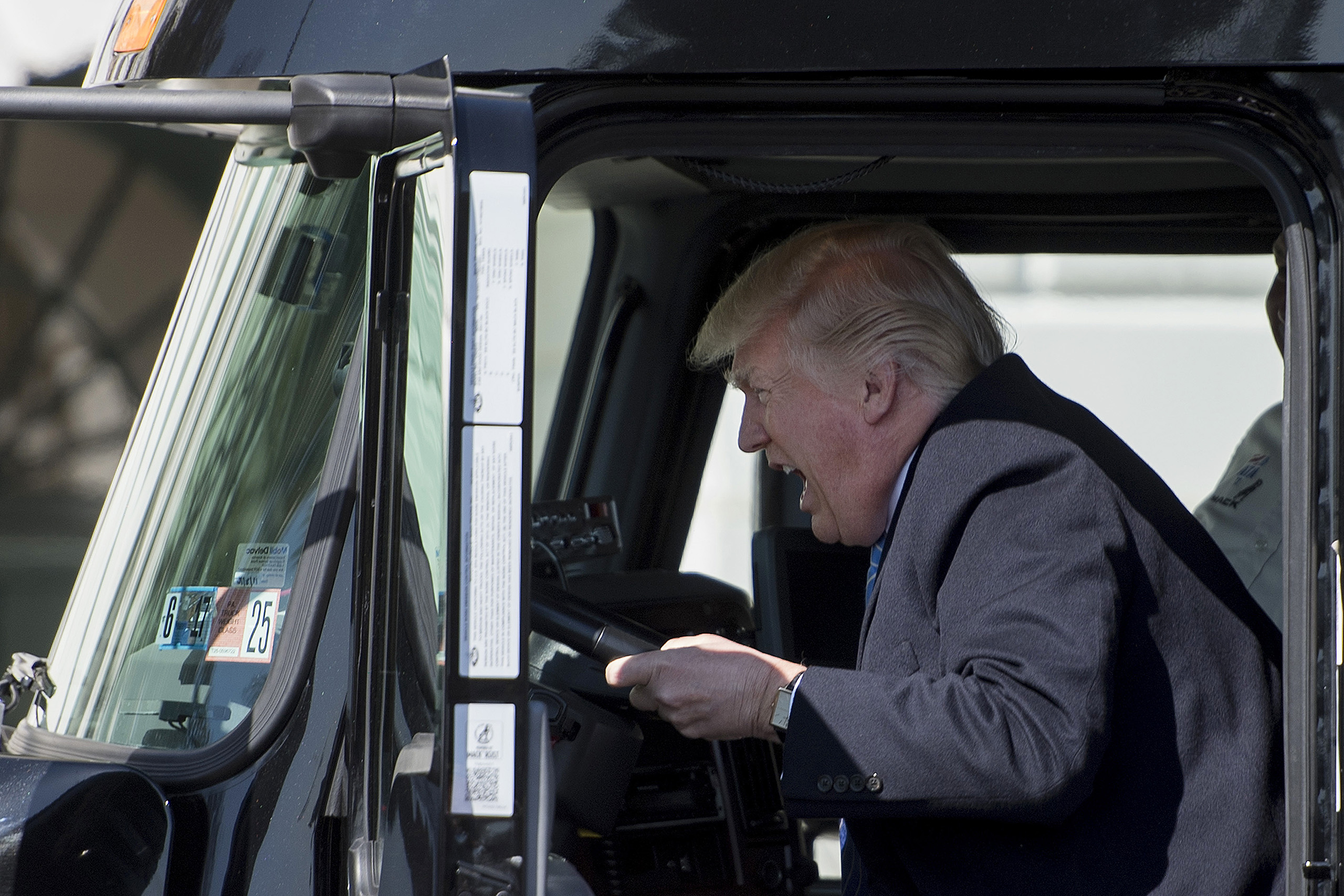 President Donald Trump posed in drivers seat of a semi-truck as he welcomes truckers and CEOs to the White House to discuss healthcare on, March 23, 2017.