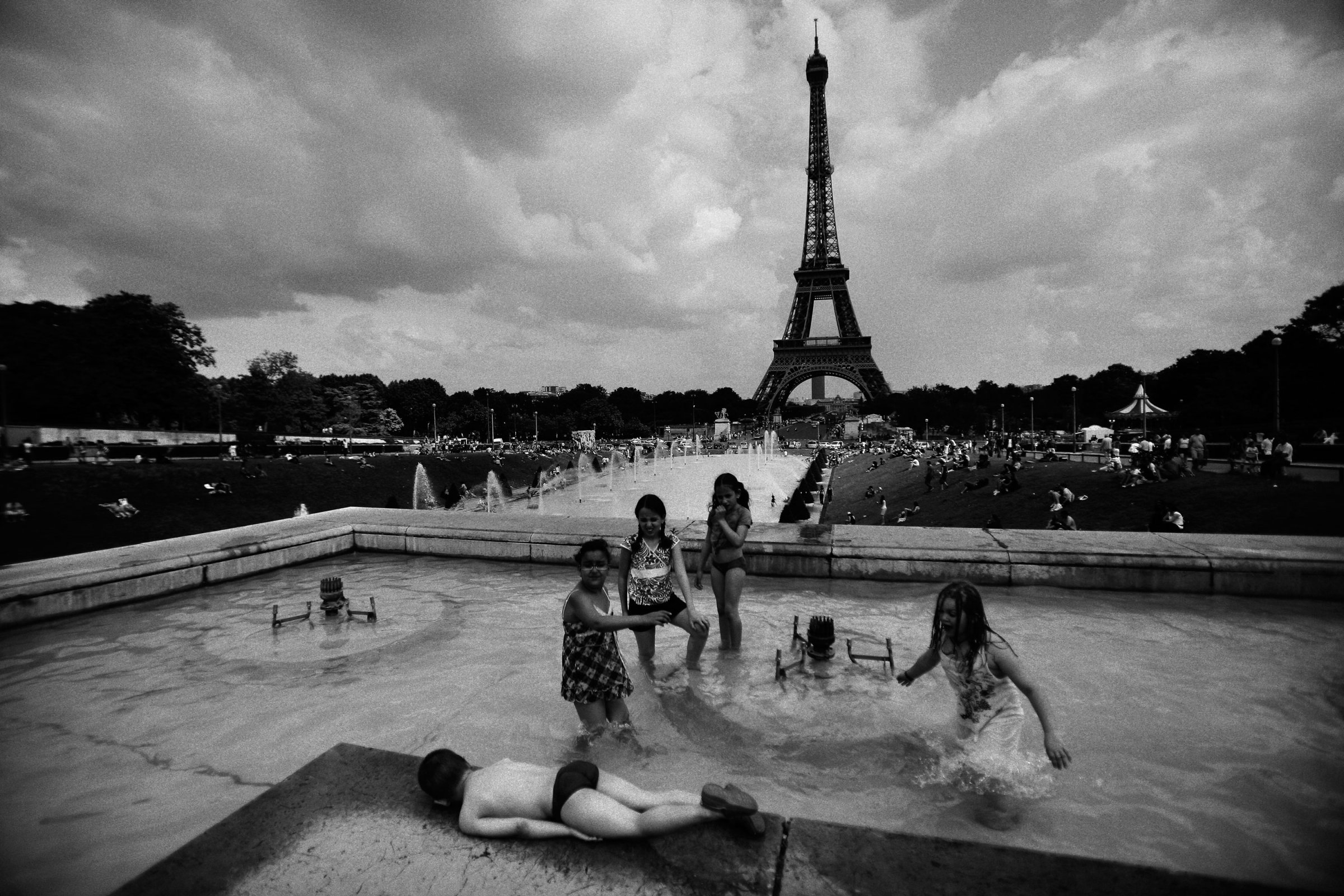 Children play in a fountain at Place du Trocadero in Paris on June 1, 2009.