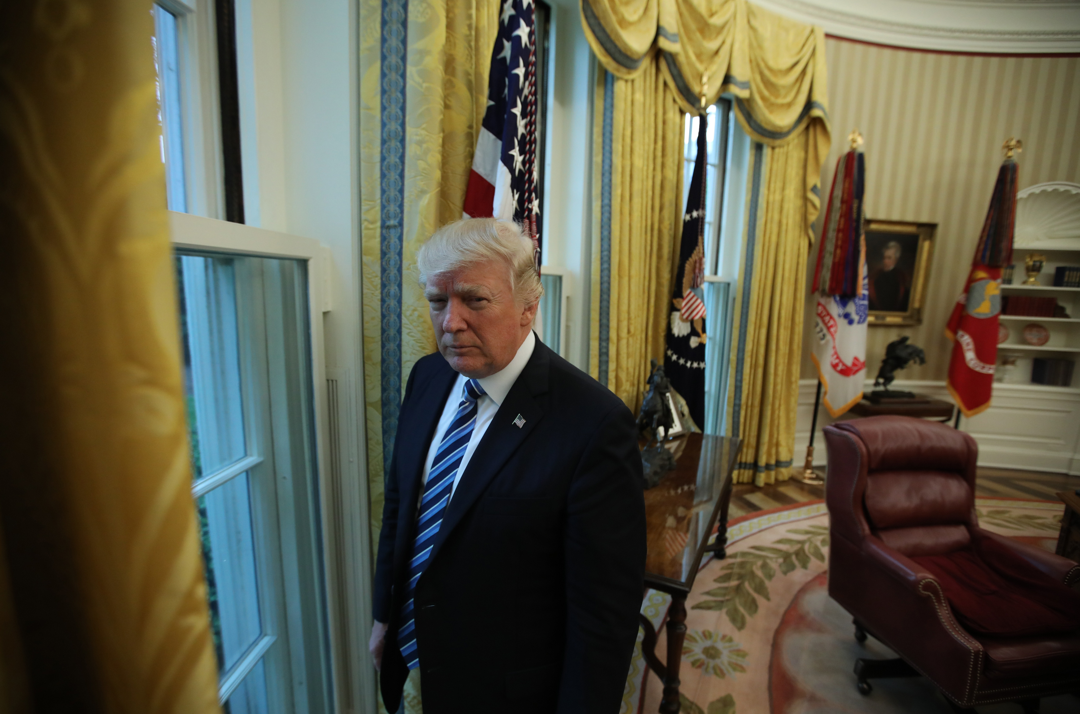 President Trump stands in the Oval Office following an interview with Reuters at the White House in Washington, April 27, 2017. (Carlos Barria—Reuters)