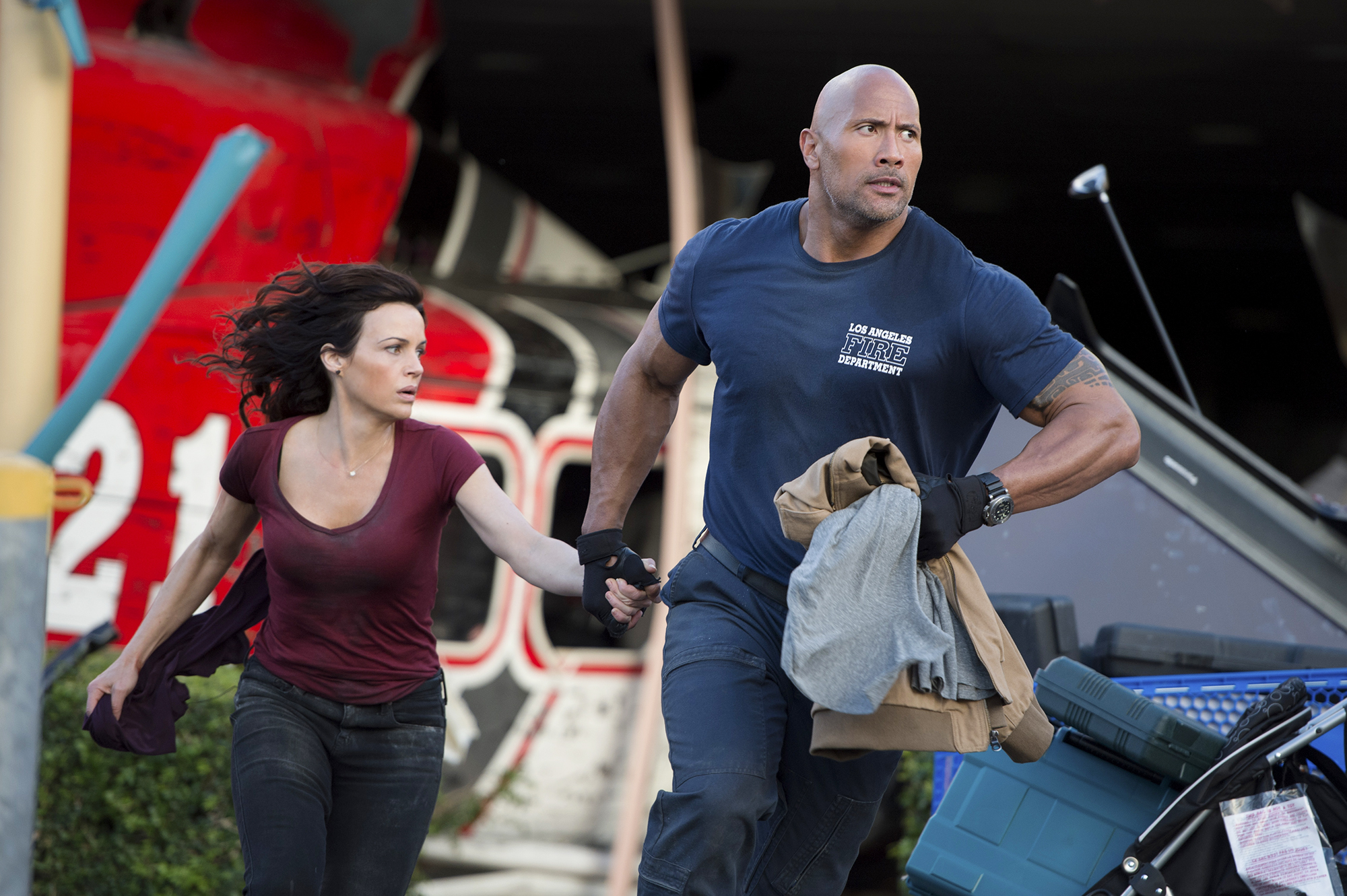 Dwayne Johnson, as Ray Gaines, and Carla Gugino, as Emma Gaines, in San Andreas in 2015.