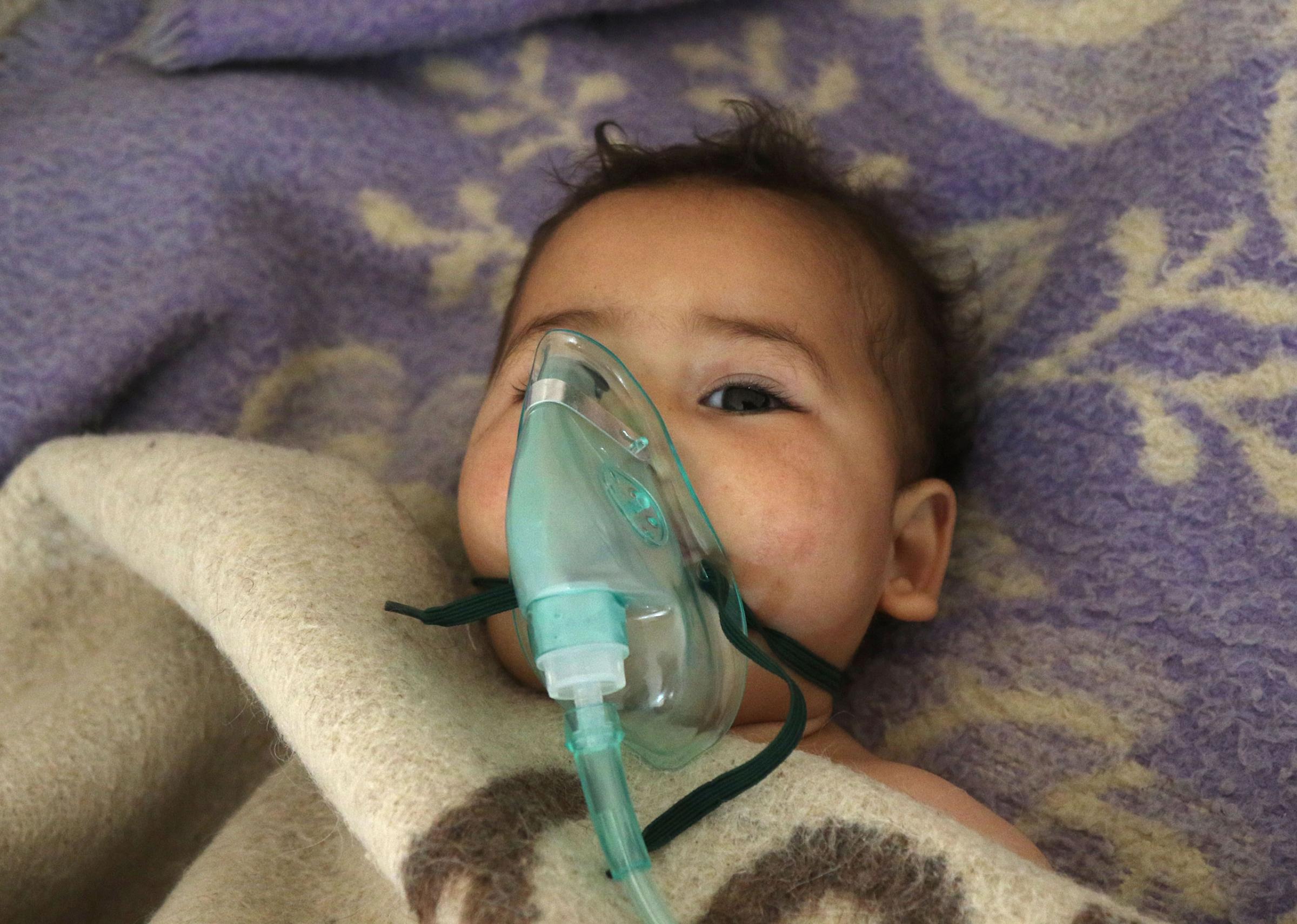 A Syrian child receives treatment after a suspected gas attack at a small hospital in Maaret al-Noman, a rebel-held town in Idlib province, on April 4, 2017. The Syrian Observatory for Human Rights said those killed in the town of Khan Sheikhun, in Idlib province, had died from the effects of the gas, adding that dozens more suffered respiratory problems and other symptoms.