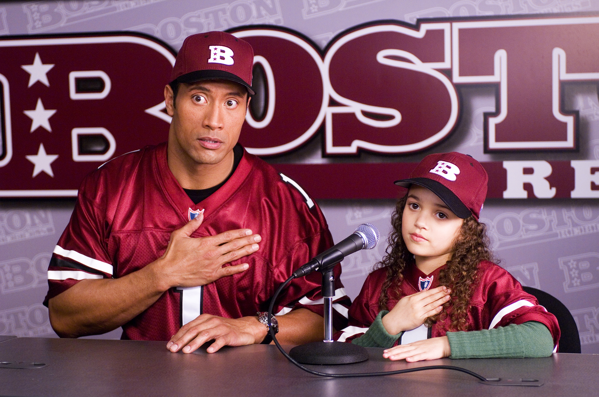 Dwayne Johnson, as Joe Kingman, and Madison Pettis, as Peyton Kelly, in The Game Plan in 2007.