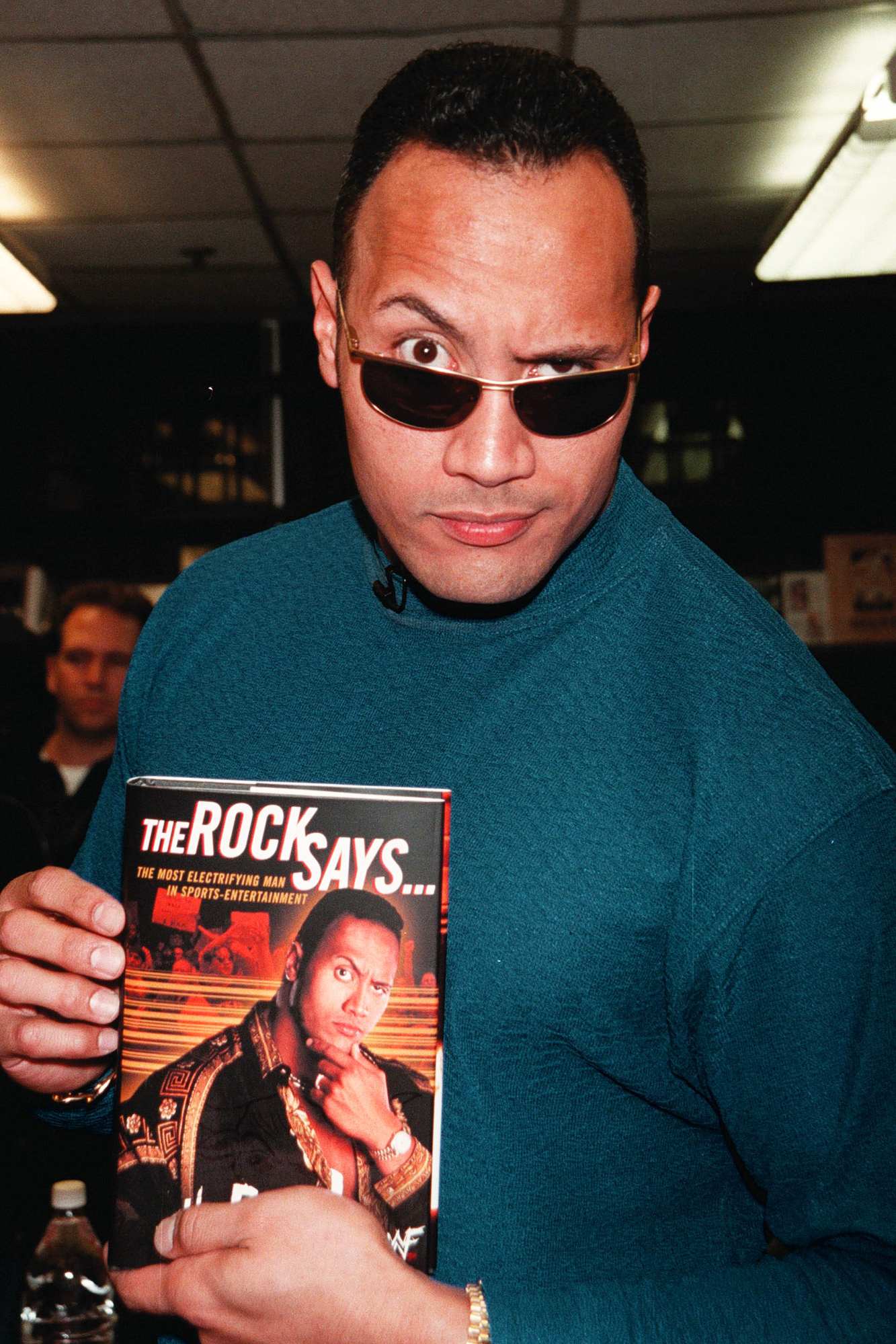 Johnson, as The Rock, at a signing for his book The Rock Says... in 2000. The book debuted at No. 1 on the New York Times Best Sellers list.