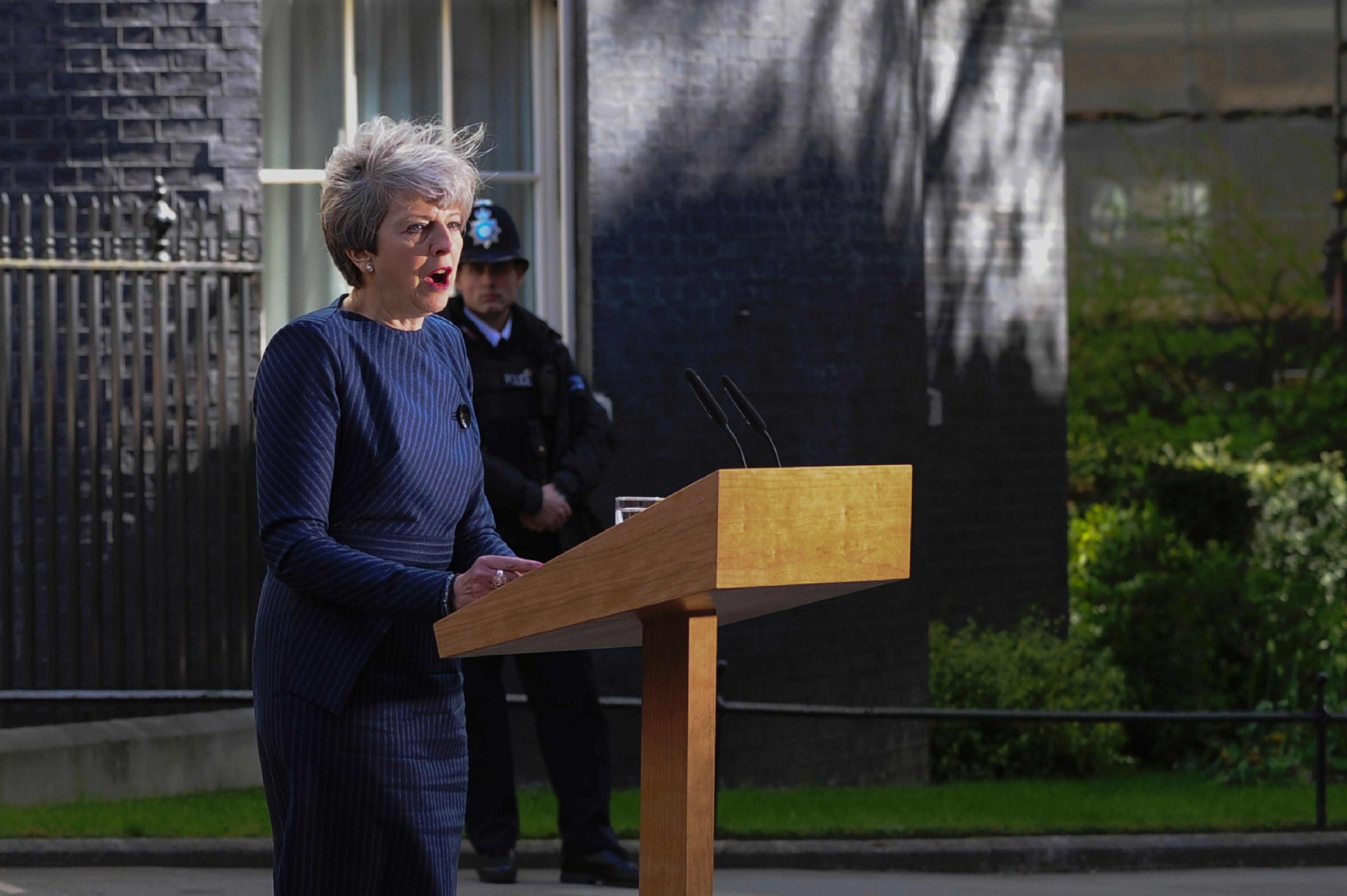 British Prime Minister Theresa May speaks to the media outside 10 Downing Street in central London on April 18, 2017.