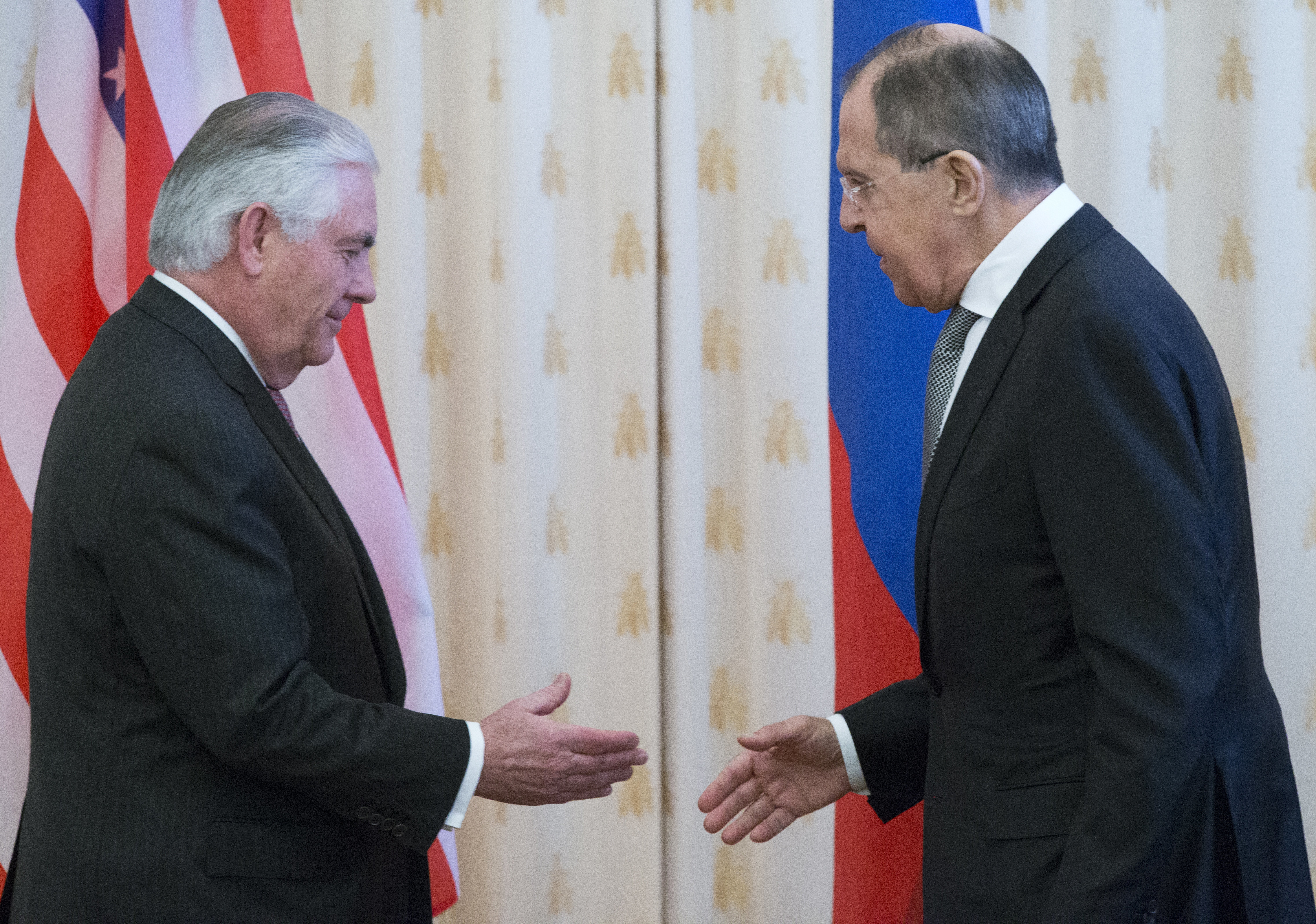 Secretary of State Rex Tillerson, left, and Russian Foreign Minister Sergey Lavrov shake hands prior to their talks in Moscow,  April 12, 2017.
