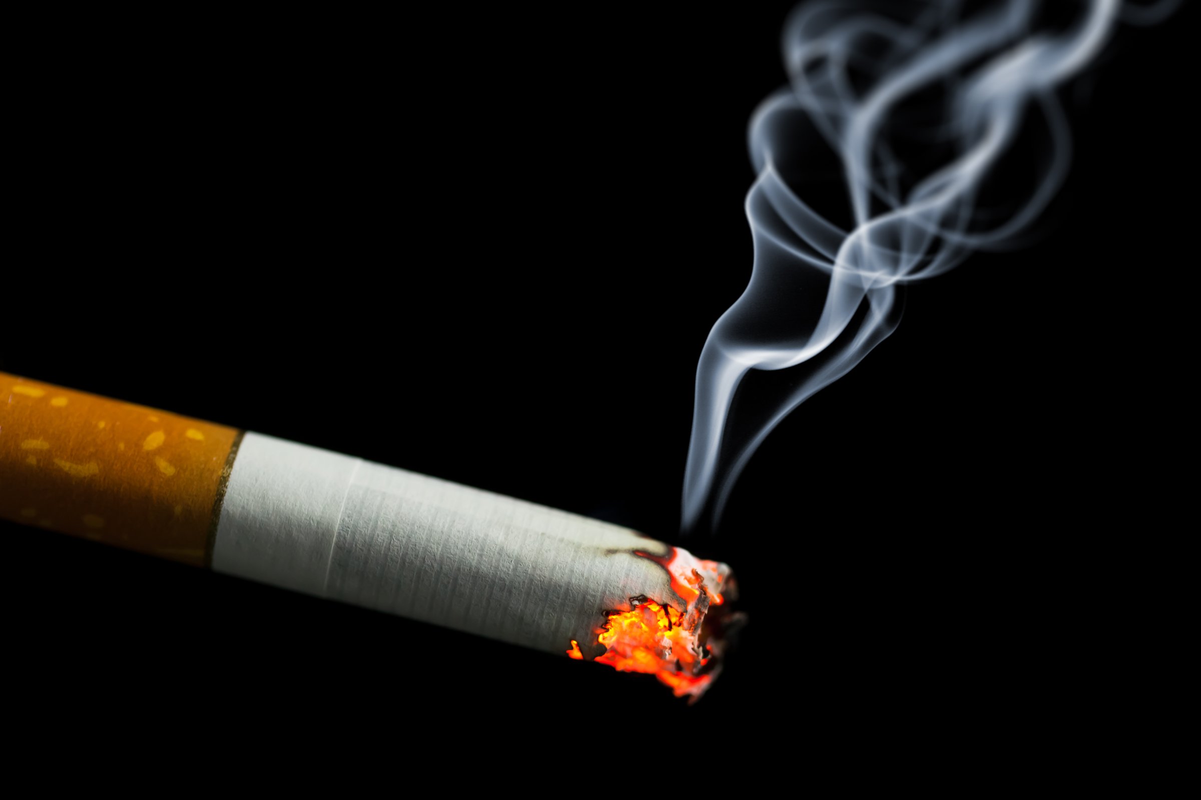 burning cigarette with smoke TIME health stock