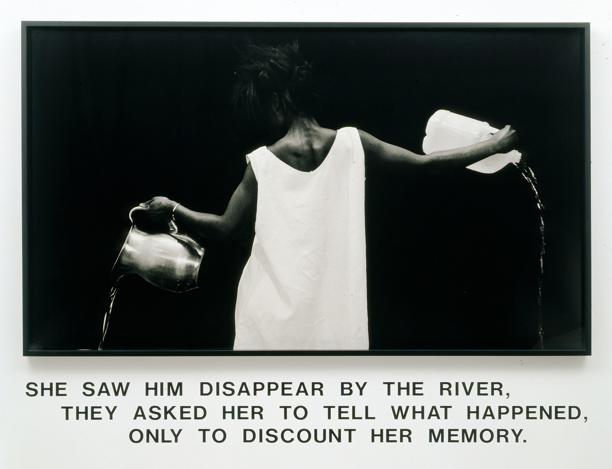 Lorna Simpson (American, born 1960). Waterbearer, 1986. Gelatin silver print with vinyl lettering, 59 × 80 × 2¼ in. (149.9 × 203.2 × 5.7 cm). Courtesy of Lorna Simpson. © 1986 Lorna SimpsonAny reproduction of the Work must not have any image, text, etc. superimposed over it, nor may the Work be reproduced on colored stock, nor shall it be reproduced in part, nor combined with work by others. All artworks must be reproduced in FULL COLOR.