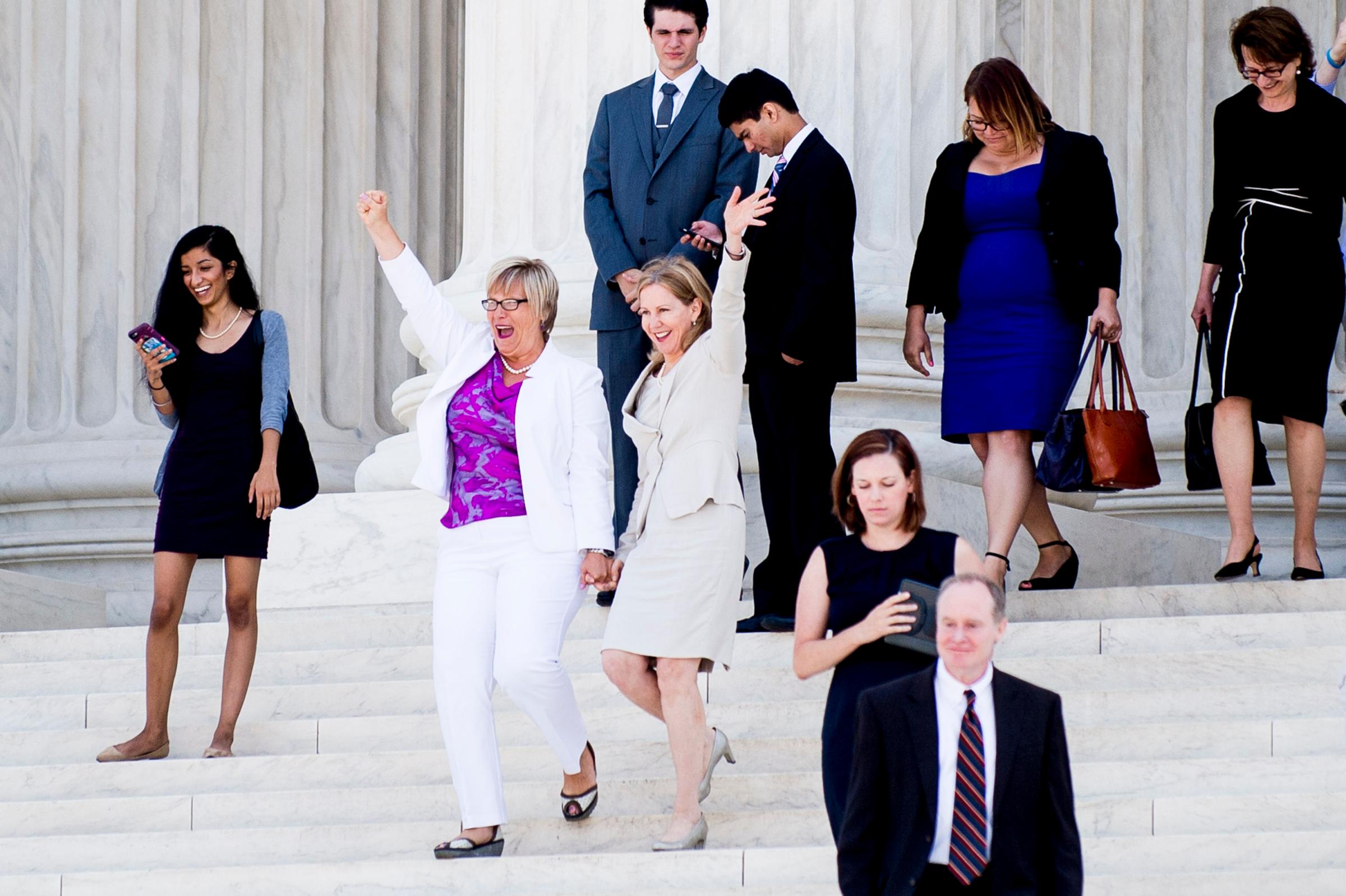 Texas abortion provider Amy Hagstrom-Miller and Nancy Northup, President of The Center for Reproductive Rights, wave to supporters as they descend the steps of the Supreme Court on June 27, 2016. In a 5-3 decision, the Court struck down one of the nation's toughest restrictions on abortion, a Texas law that women's groups said would have forced more than three-quarters of the state's clinics to close.