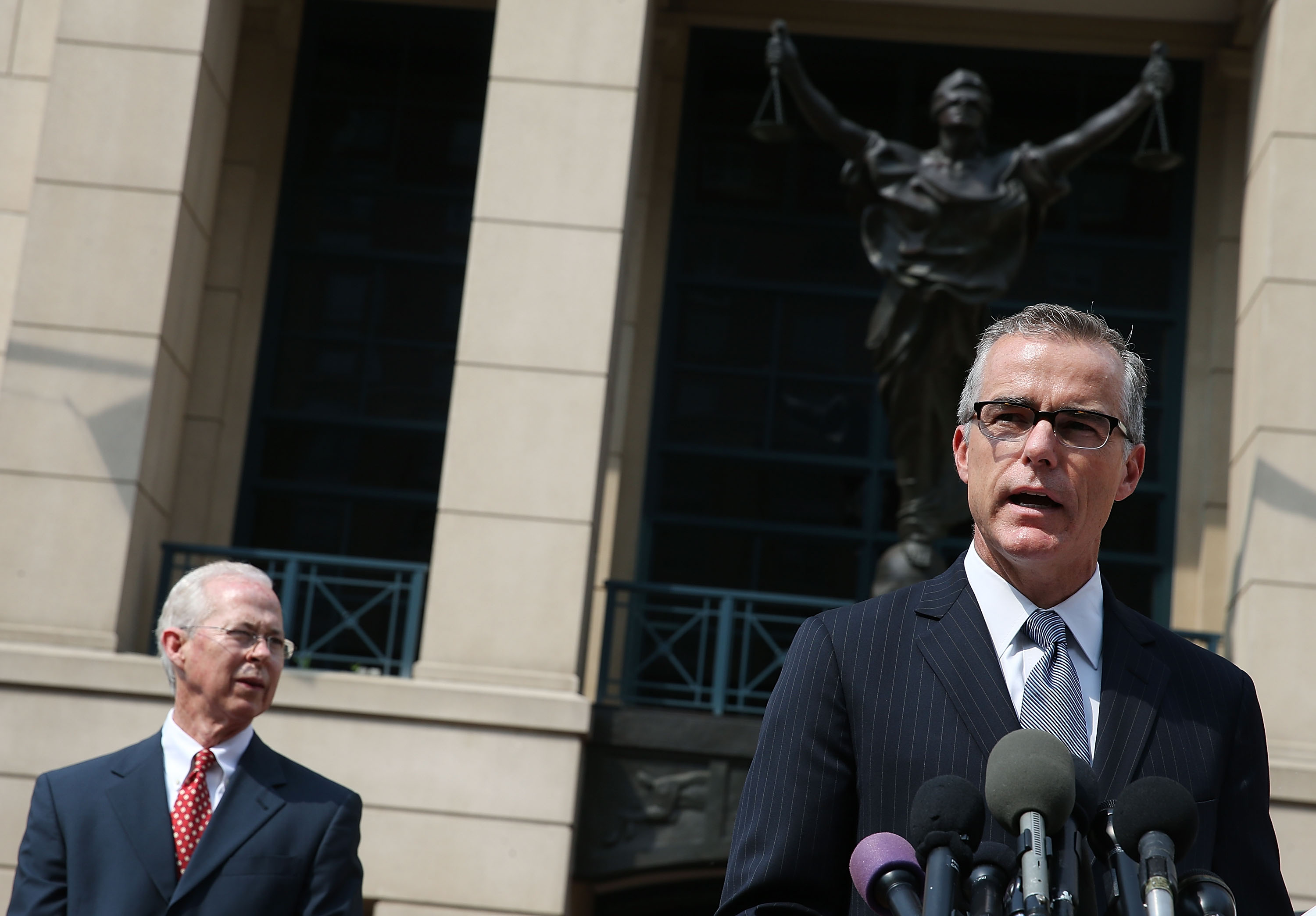 Andrew G. McCabe (R), Assistant Director of the FBI's Washington Field Office speaks while flanked by Dana J. Boente (L), U.S. Attorney for the Eastern District of Virginia, after a hearing in federal court June 11, 2015 in Alexandria, Virginia. (Mark Wilson—Getty Images)