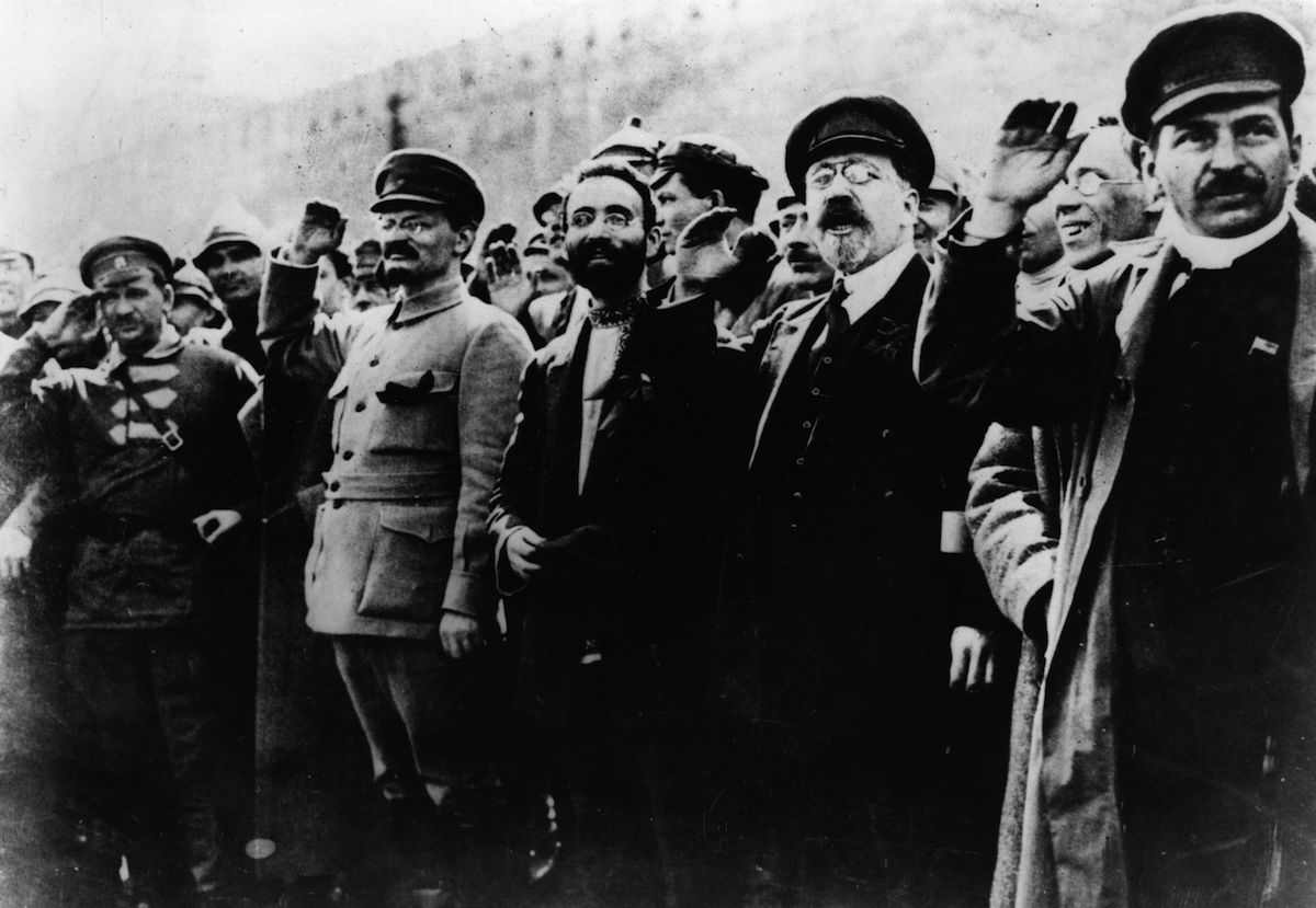 Communist leaders including Joseph Stalin (1879 - 1953) and Leon Trotsky (1879 - 1940) seen saluting in the street in 1917. (Keystone / Getty Images)
