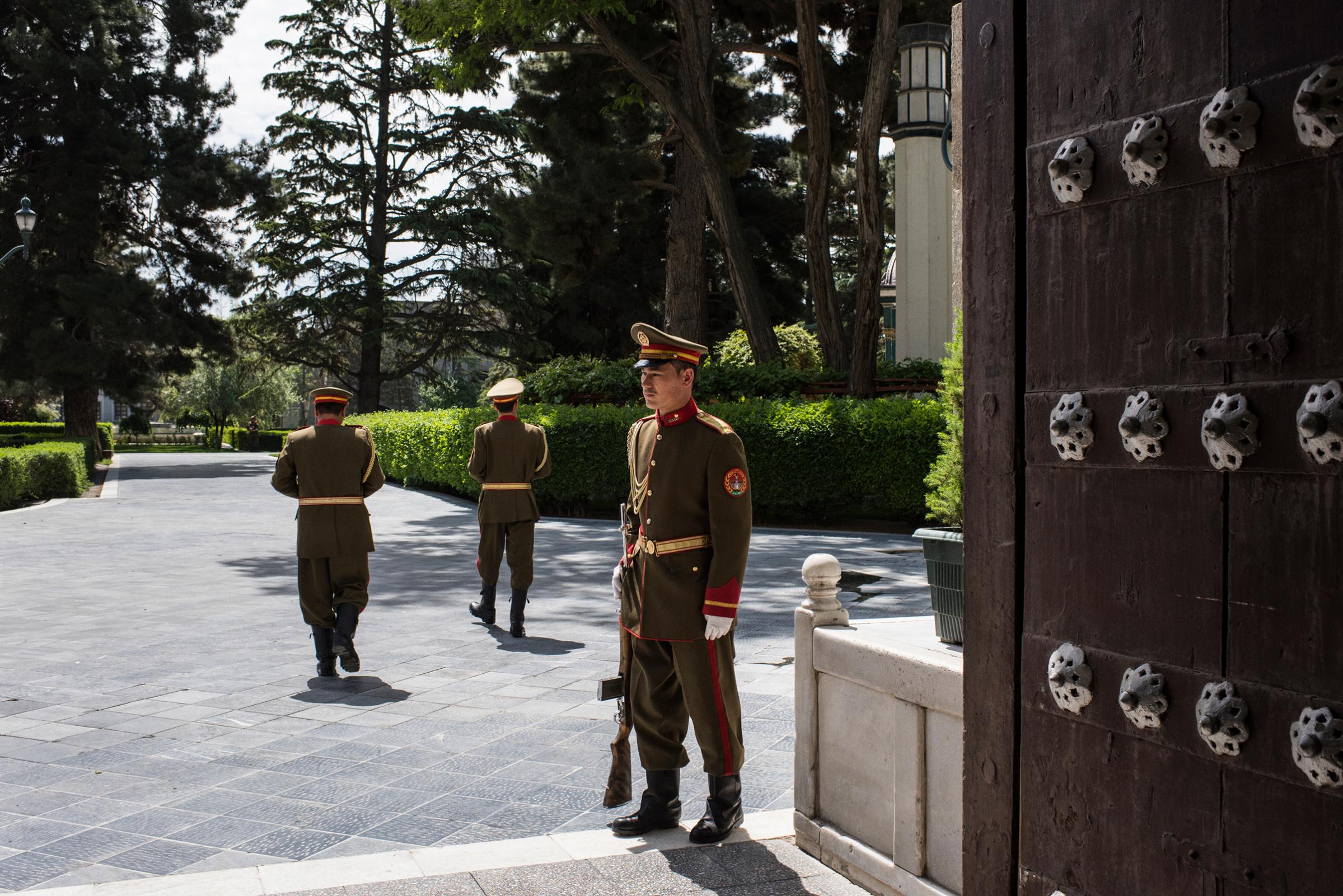 A presidential guard stands watch inside the palace compound in Kabul on May 11, 2017.