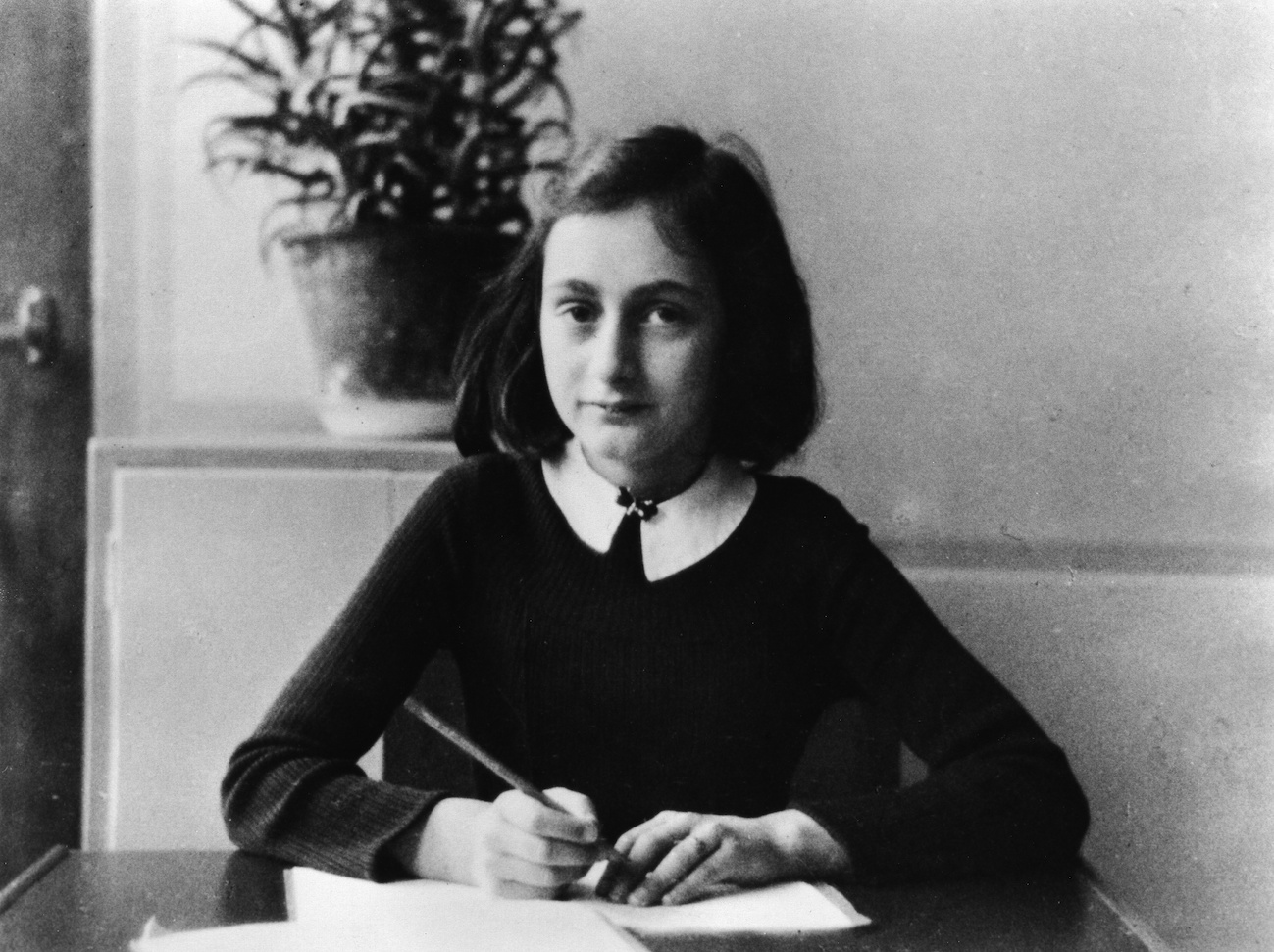 Anne Frank, as a 12-year old doing her homework in 1941 (ullstein bild / Getty Images)