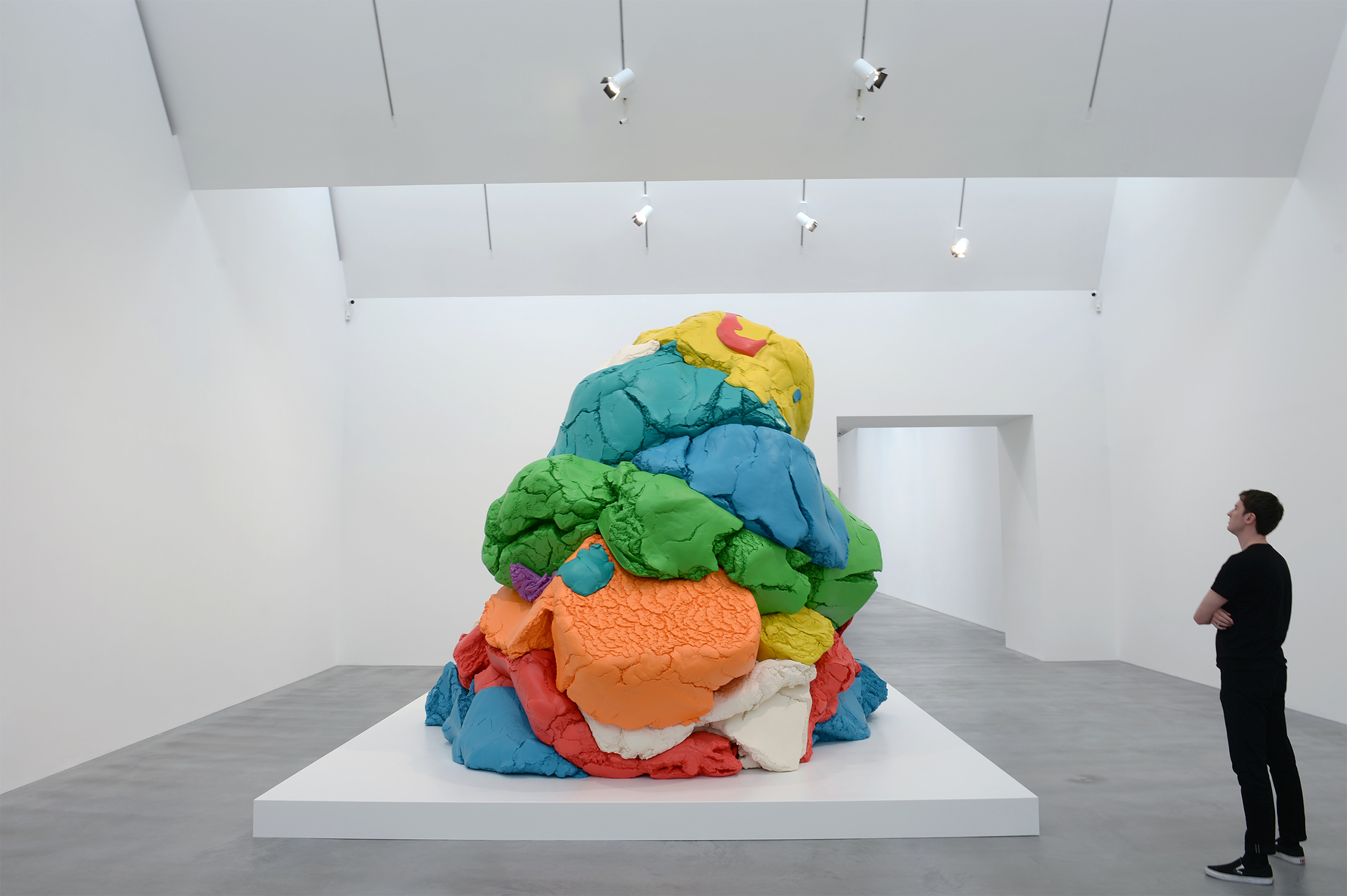 A man views Jeff Koons' sculpture "Play-Doh 1994-2014" during the opening of the Newport Street Gallery's new exhibition, "Jeff Koons: Now" in London, UK on May 17, 2016. (Anthony Devlin—PA Wire/AP)