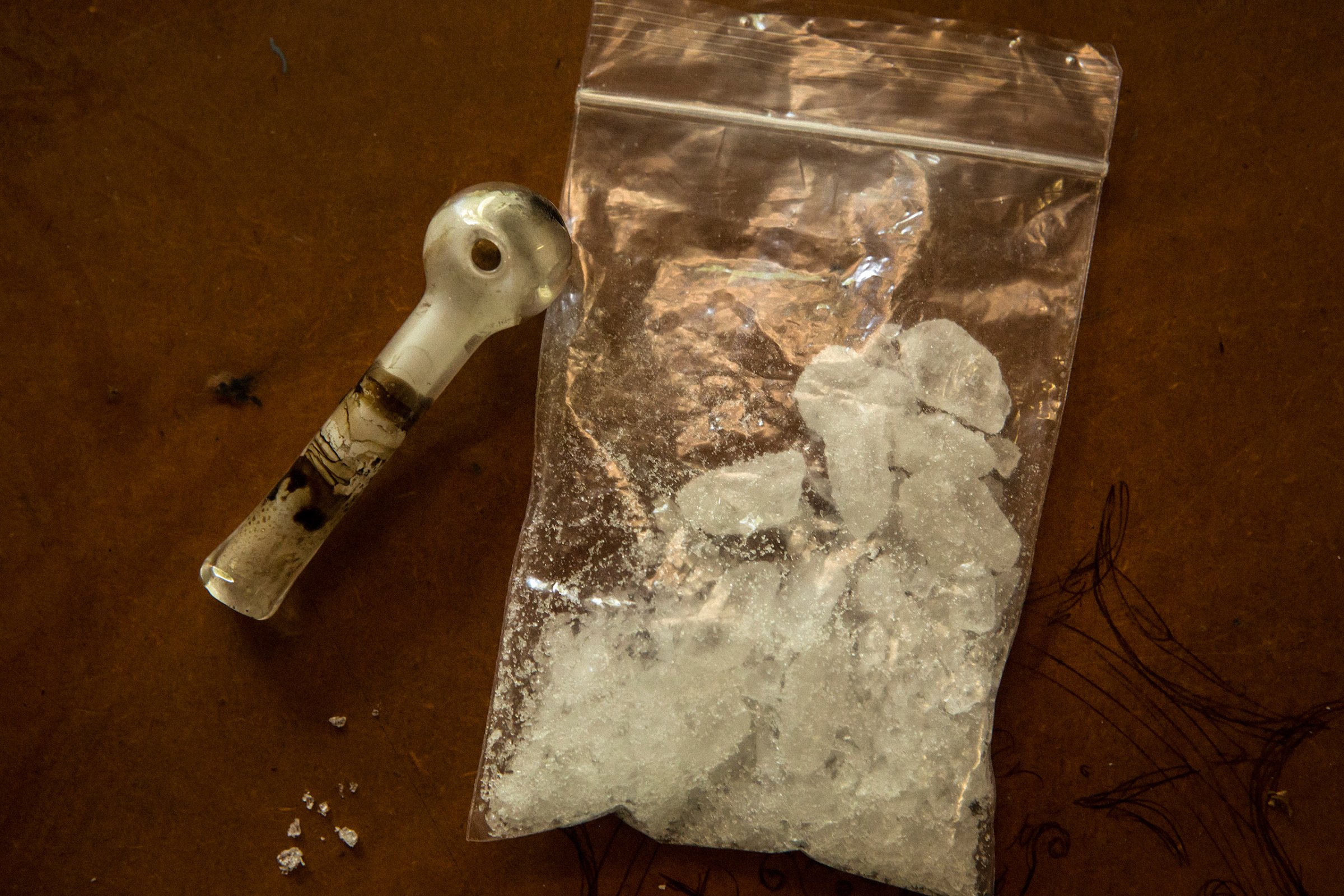 A bag of ice, about four-fifths of an ounce, next to a glass pipe in Rockhampton.