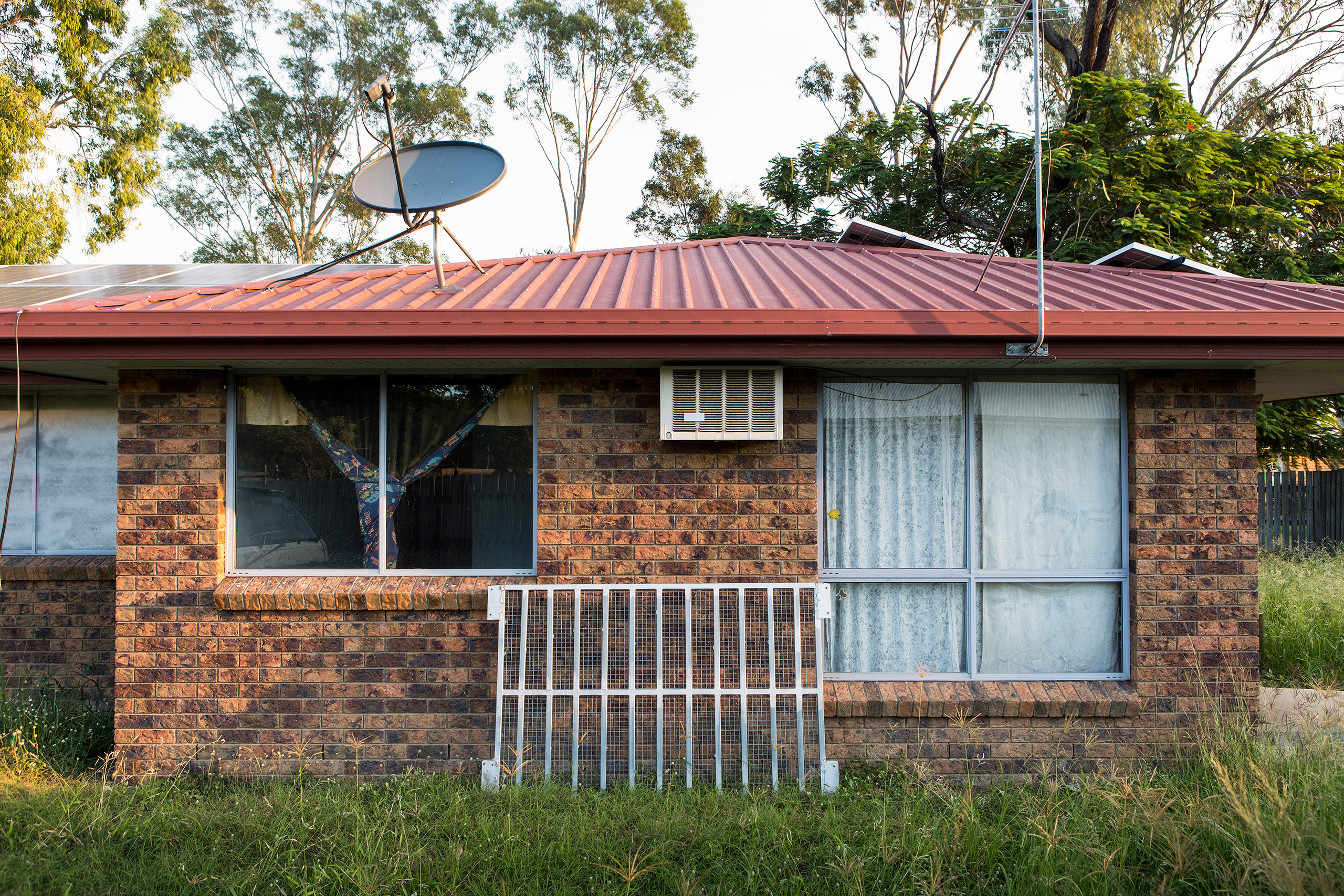 Part of the cage that Daphne used to lock in her son Wylie rests against their previous home in Rockhampton. (David Maurice Smith—Oculi for TIME)