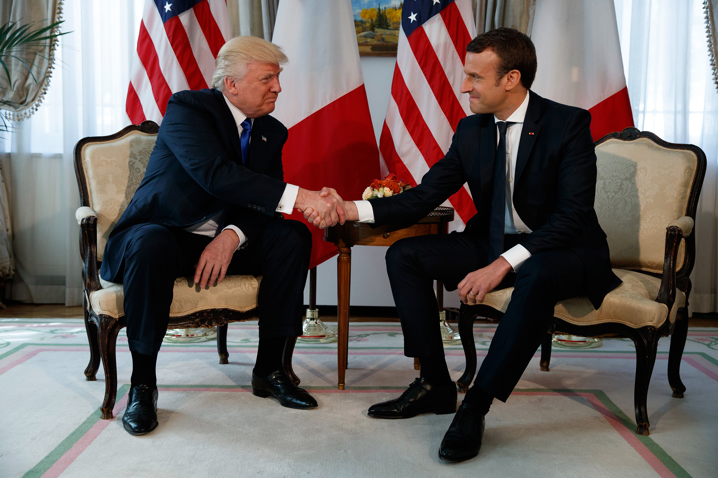 President Trump shakes hands with French President Emmanuel Macron during a meeting at the U.S. Embassy in Brussels on May 25, 2017.