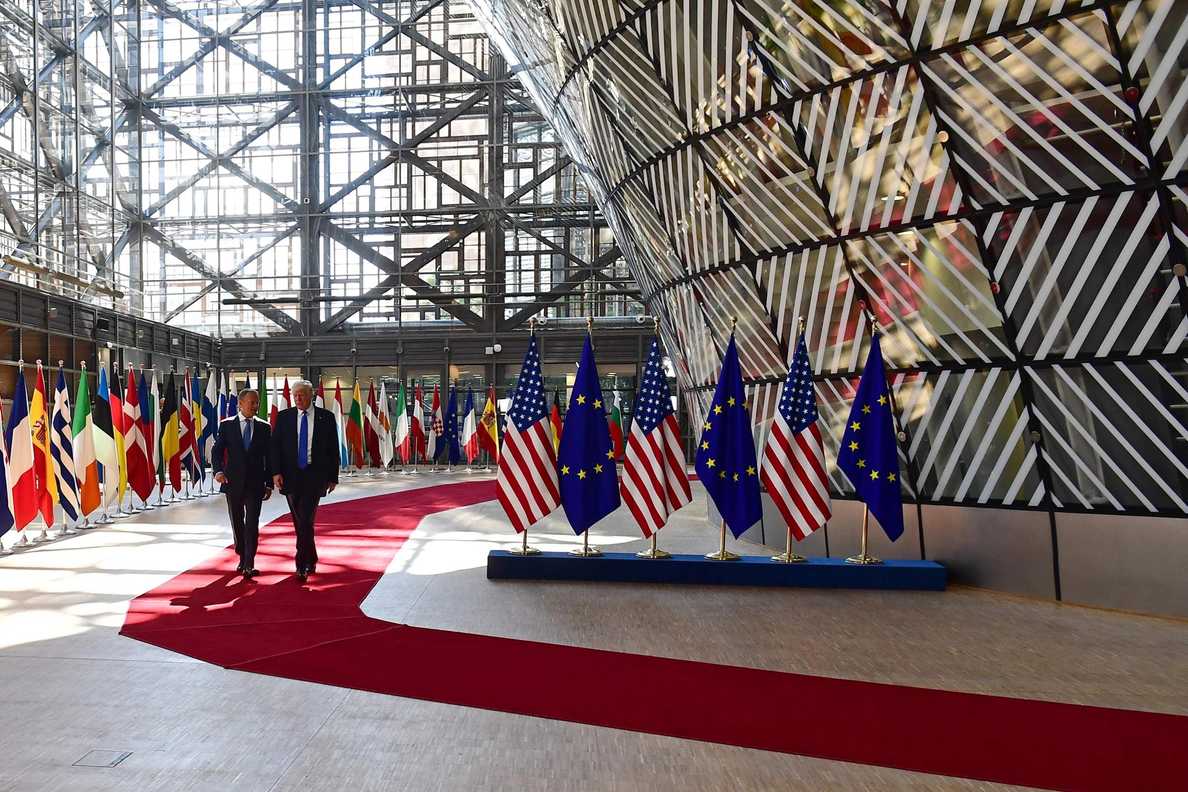 European Council President Donald Tusk speaks to President Trump after welcoming him at the E.U. headquarters, as part of the NATO meeting, in Brussels on May 25, 2017.