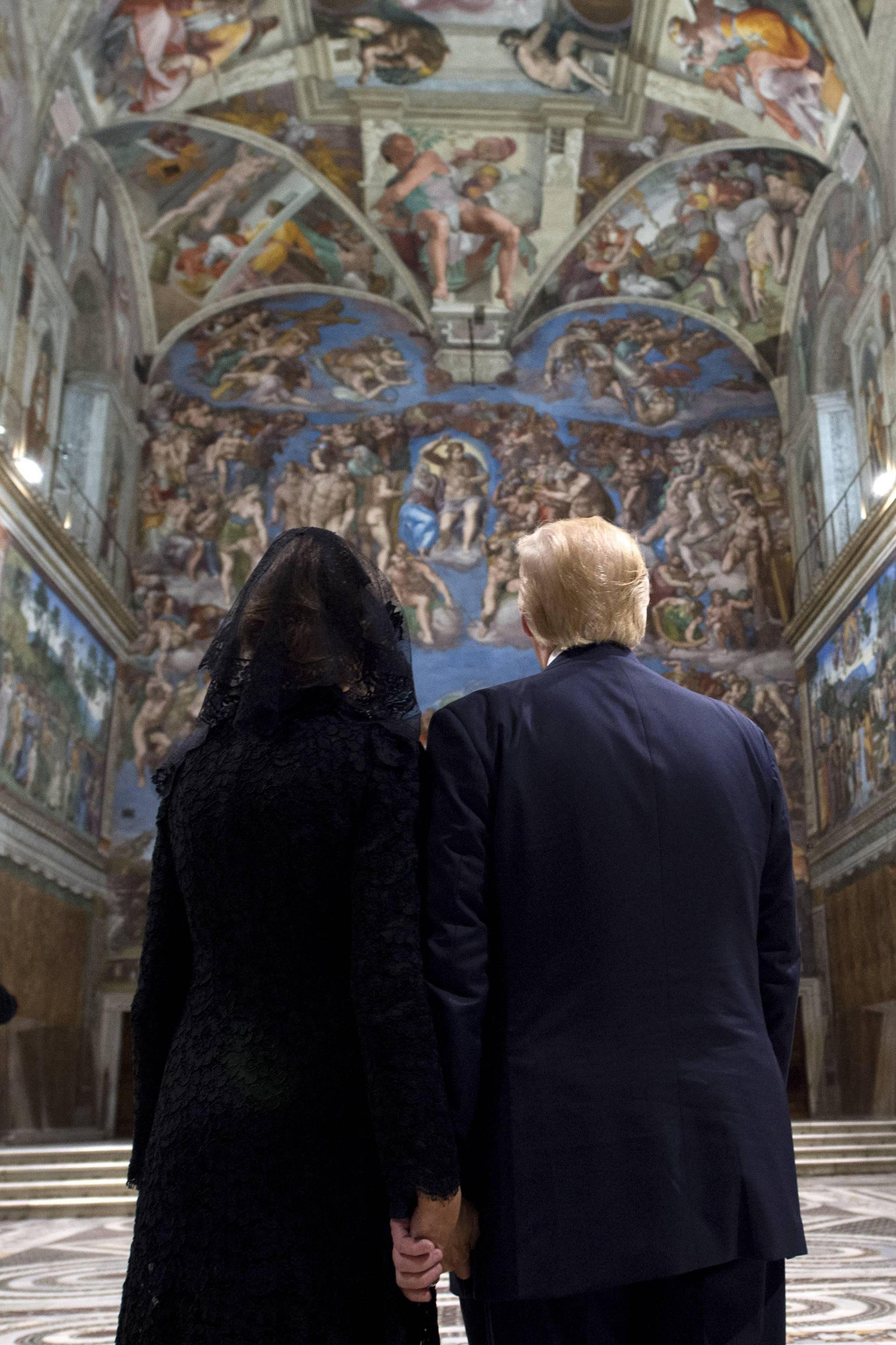 President Trump and First Lady Melania Trump admire the frescoed ceilings during their visit to the Sistine Chapel at the Vatican on May 24, 2017.