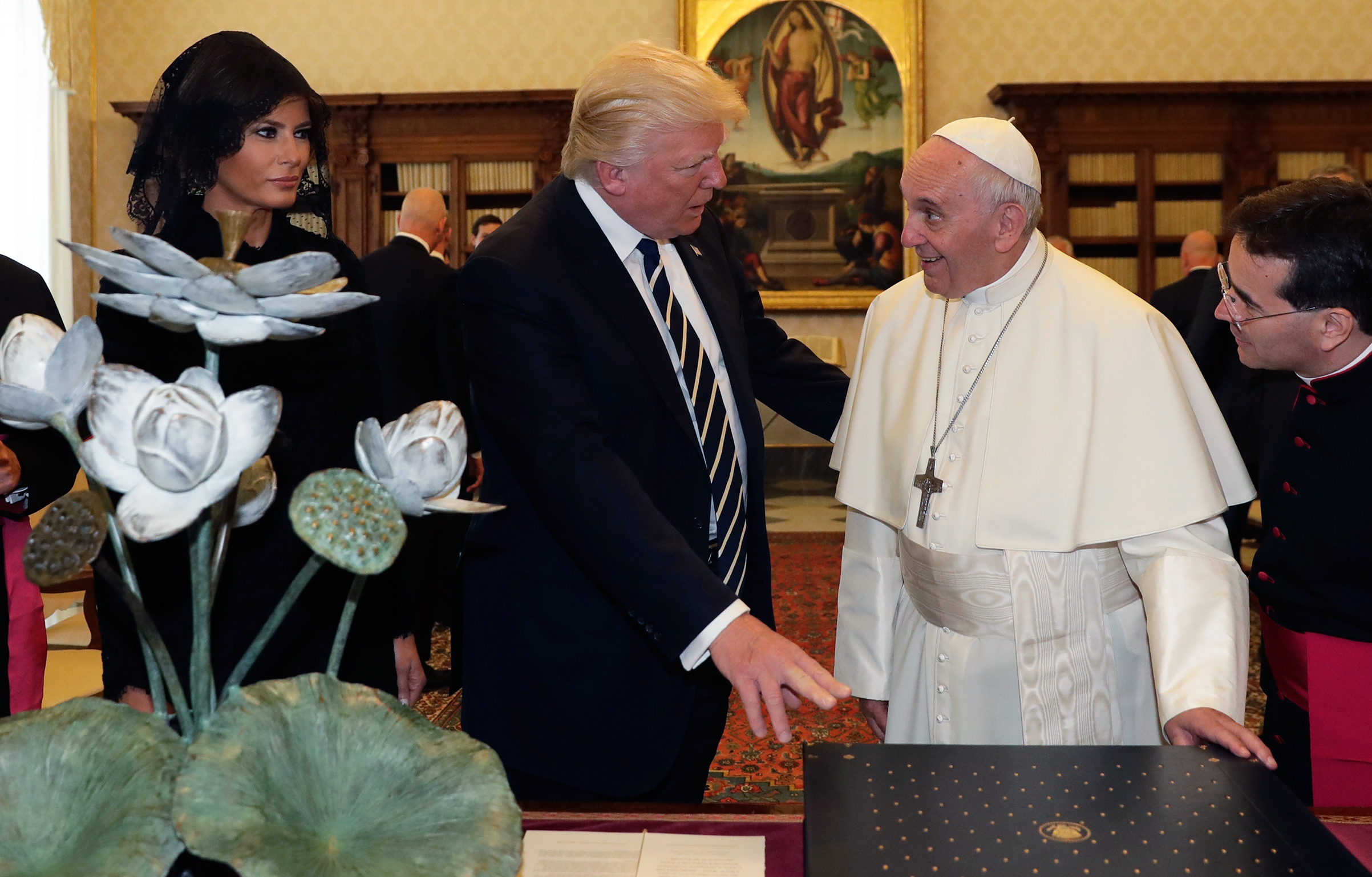 Pope Francis exchanges gifts with President Trump and First Lady Melania Trump at the Vatican on May 24, 2017. (Alessandra Tarantino—Pool/AP)