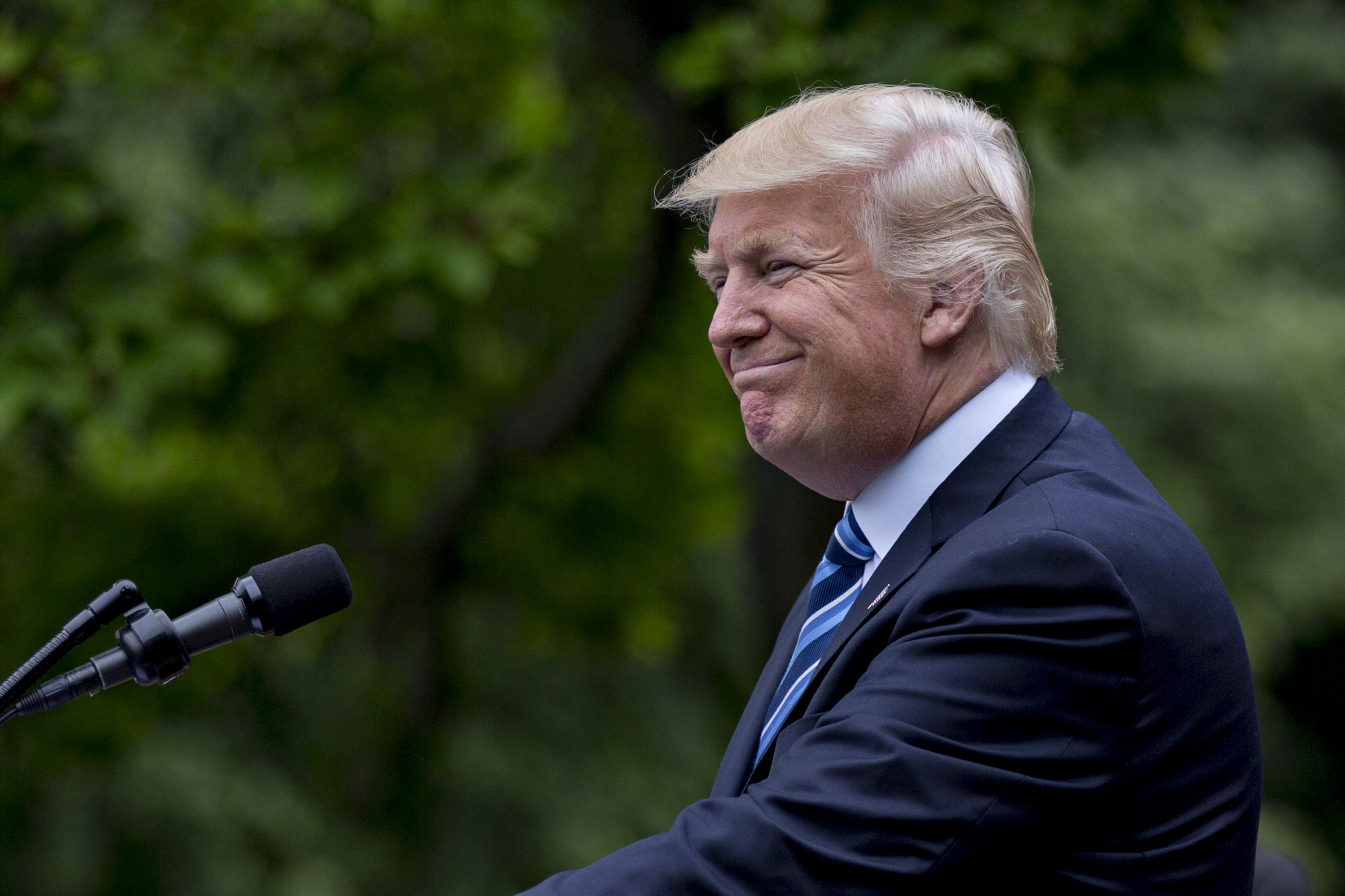 President Donald Trump smiles while speaking during a press conference in the Rose Garden of the White House on May 4, 2017. (Andrew Harrer—Bloomberg/Getty Images)