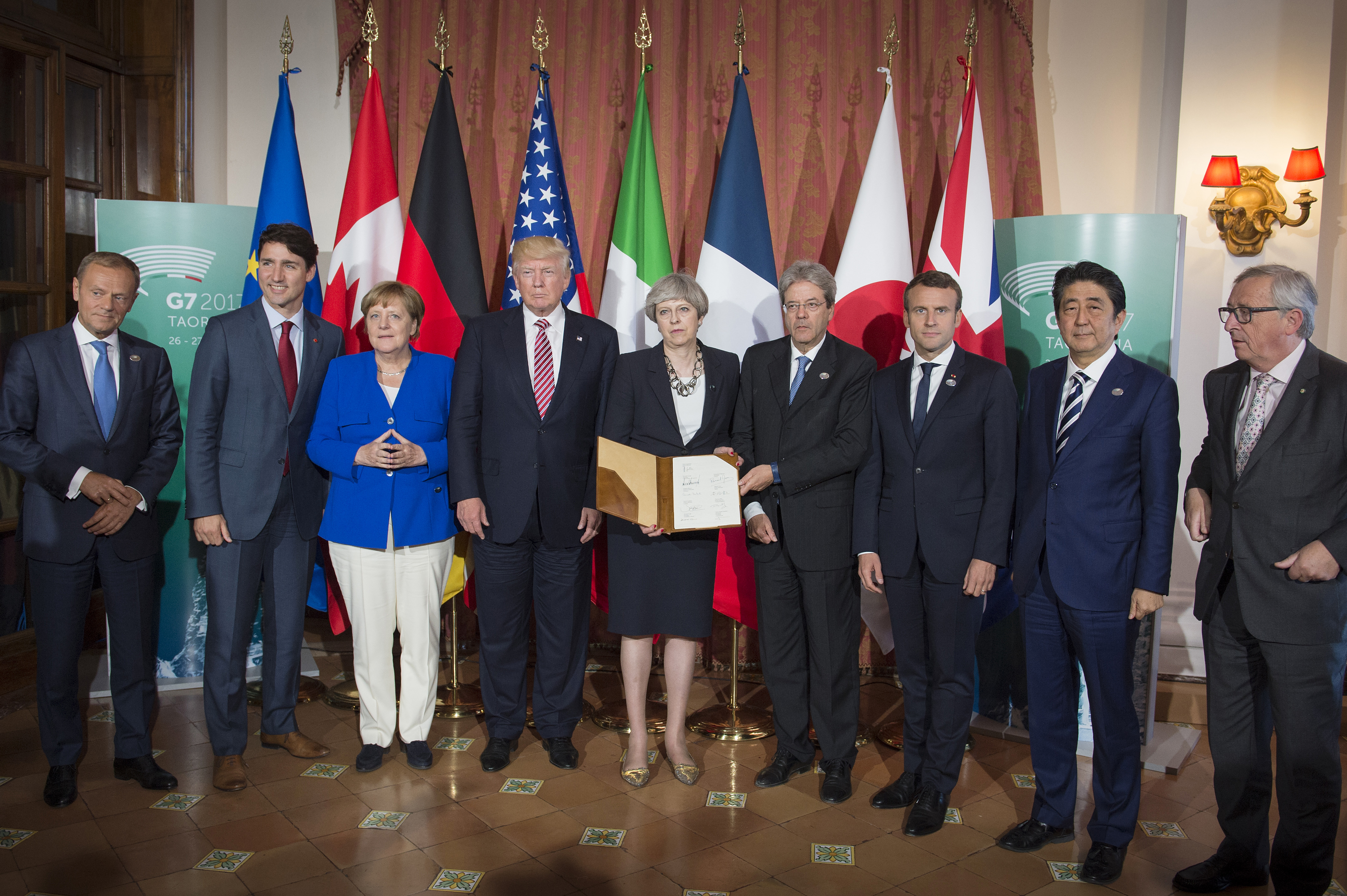 European Council President Donald Tusk, Canadian Prime Minister Justin Trudeau, German Chancellor Angela Merkel, US President Donald Trump, British Prime Minister Theresa May, Italian Prime Minister Paolo Gentiloni, French President Emmanuel Macron, Japanese Prime Minister Shinzo Abe and European Commission President Jean -Claude Juncker during the G7 summit on May 26, 2017 in Taormina, Italy. (Guido Bergmann—Bundesregierung/Getty Images)