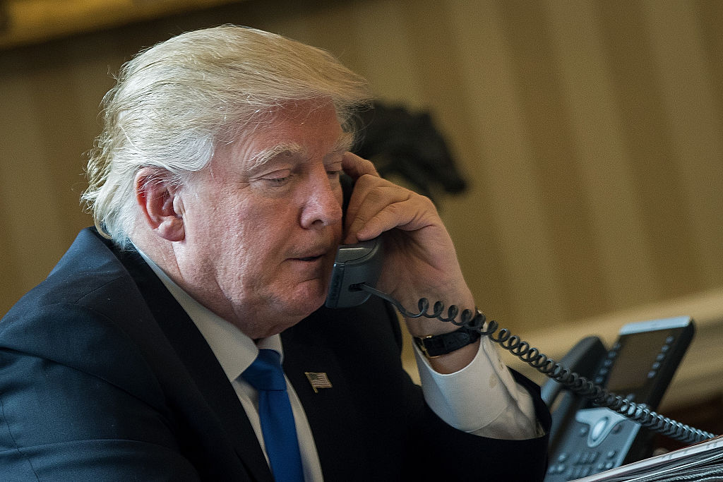 President Trump speaks on the phone with Russian President Vladimir Putin in the Oval Office of the White House, Jan. 28, 2017 in Washington, DC. (Drew Angerer—Getty Images)